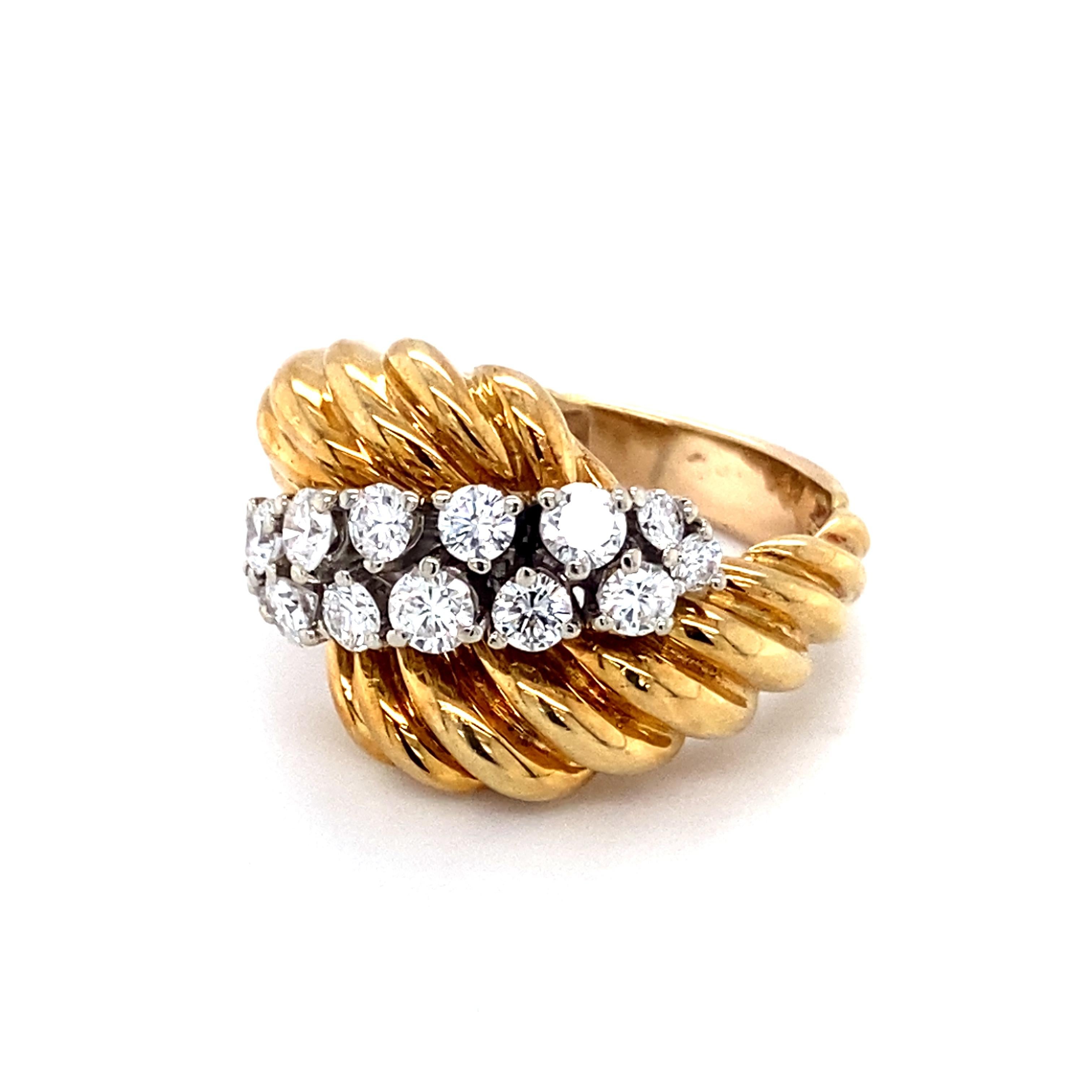 Item Details: 
Ring Size: 6
Metal Type: 18 Karat Yellow Gold
Weight: 10.1 grams

Diamond Details:
Cut:  Round
Carat: 1.00 Carat
Color: G-H
Clarity: VS

Item Features:
This beautiful ring features an ornate scalloped design that wraps around two rows