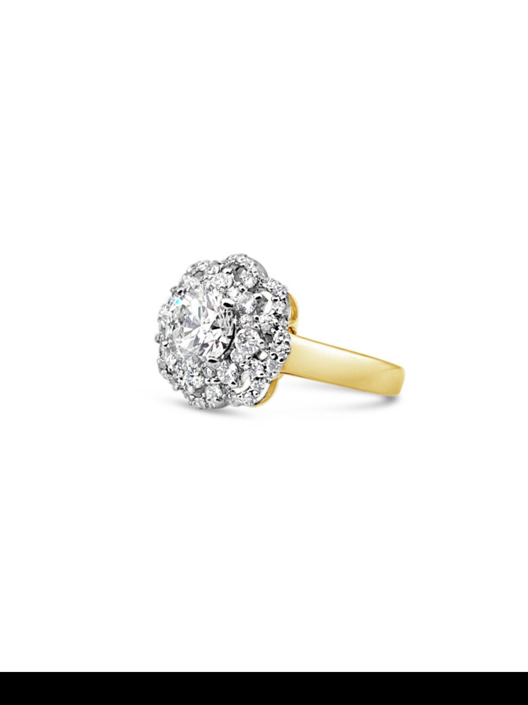 The Lona diamond ring features a 1.00 carat diamond solitaire center stone surrounded by a diamond encrusted gold band, made in a 18K yellow gold. A  beautiful accent ring, delicate yet dazzling, or that very special engagement ring for the future