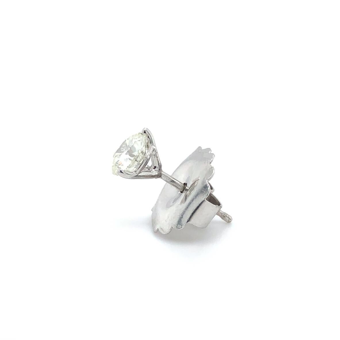 1 carat diamond earrings in ear