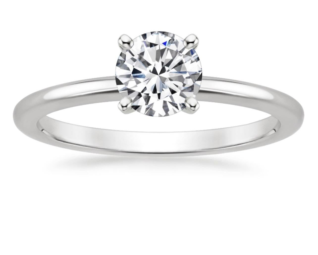 Approximately  1 Carat Diamond  Traditional Engagement Ring 14 Karat White Gold Size 7 & 1/2
6.2 mm round diamond 
Brilliant cut solitaire round diamond approximately 1 ct 
This is a Engagement Ring  from our affordable wedding collection. Please