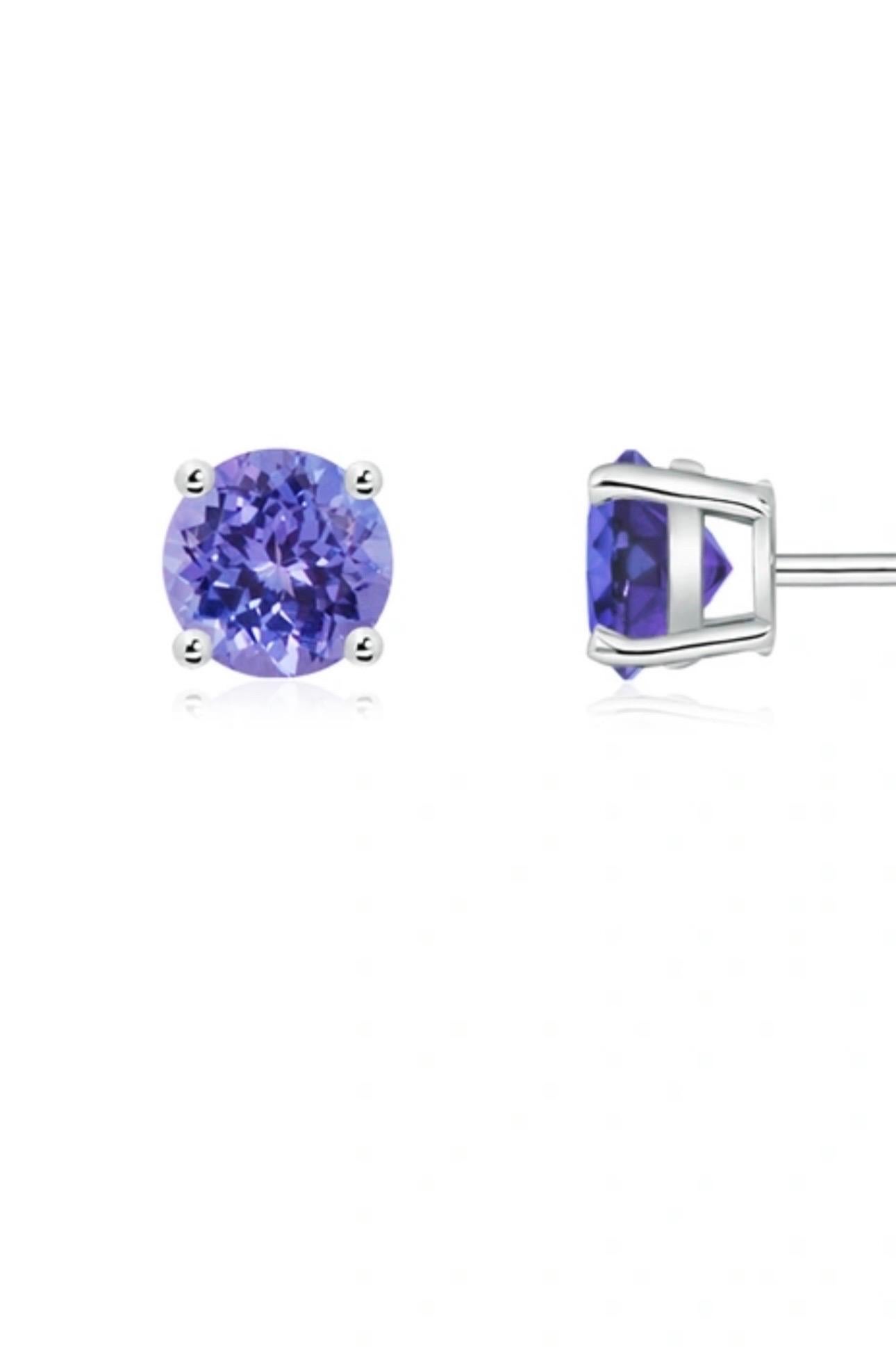 
2  Carat total  Round Cut Tanzanite.  perfect pair with  Post  Earrings  14 Karat  white Gold 
This exquisite pair of earrings are beautifully crafted with 14 karat White gold .
Weight of 14 K gold 1.5 grams
 Fine  Round Cut Tanzanite weighing