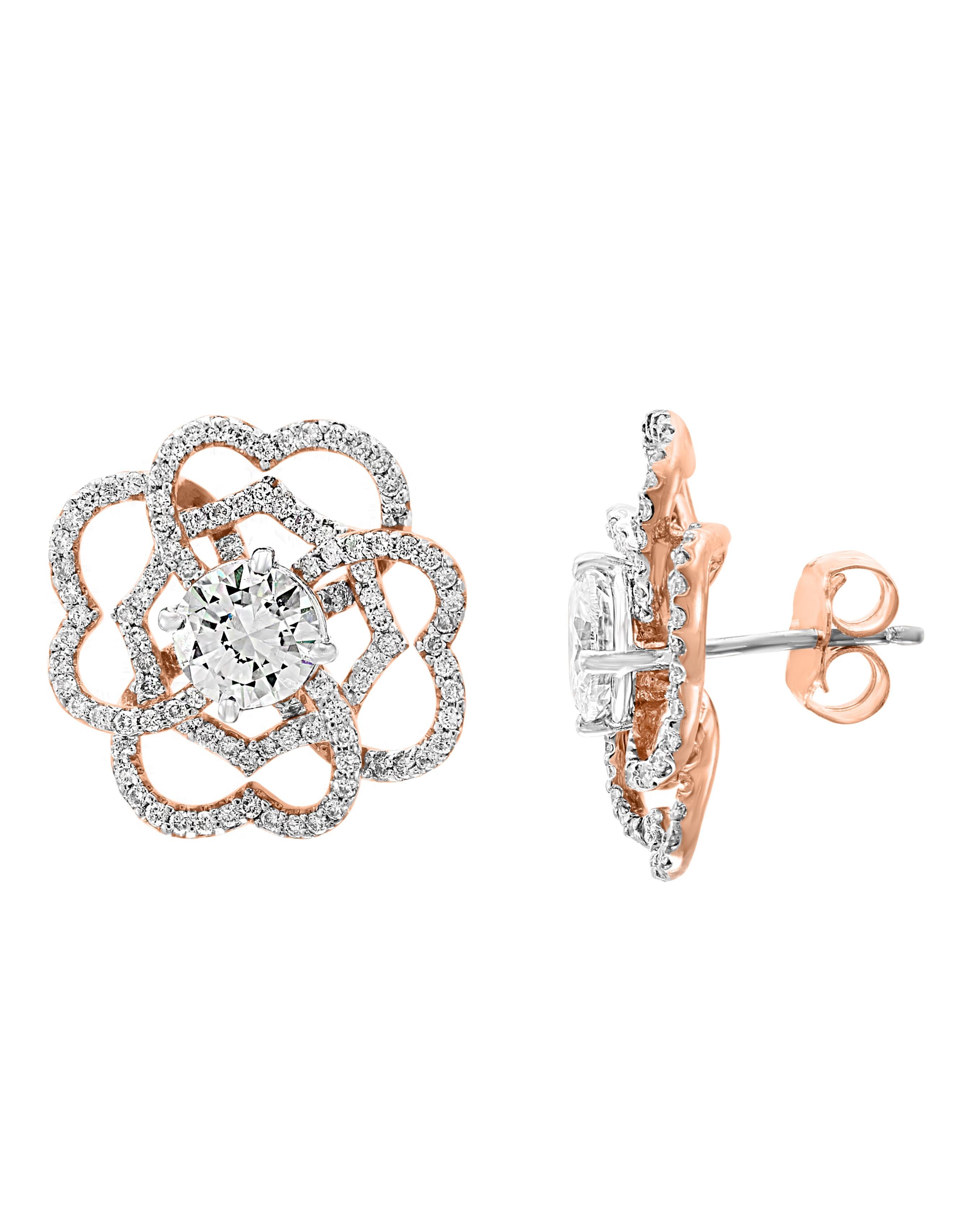 A fabulous pair of earrings with an enormous amount of look and sparkle!
almost 1  carat In the center VS2 clarity diamonds set in solid 14 karat Rose  gold  with post backs
Cluster earrings, featuring a center 1 ct  round  diamond  surrounded by 