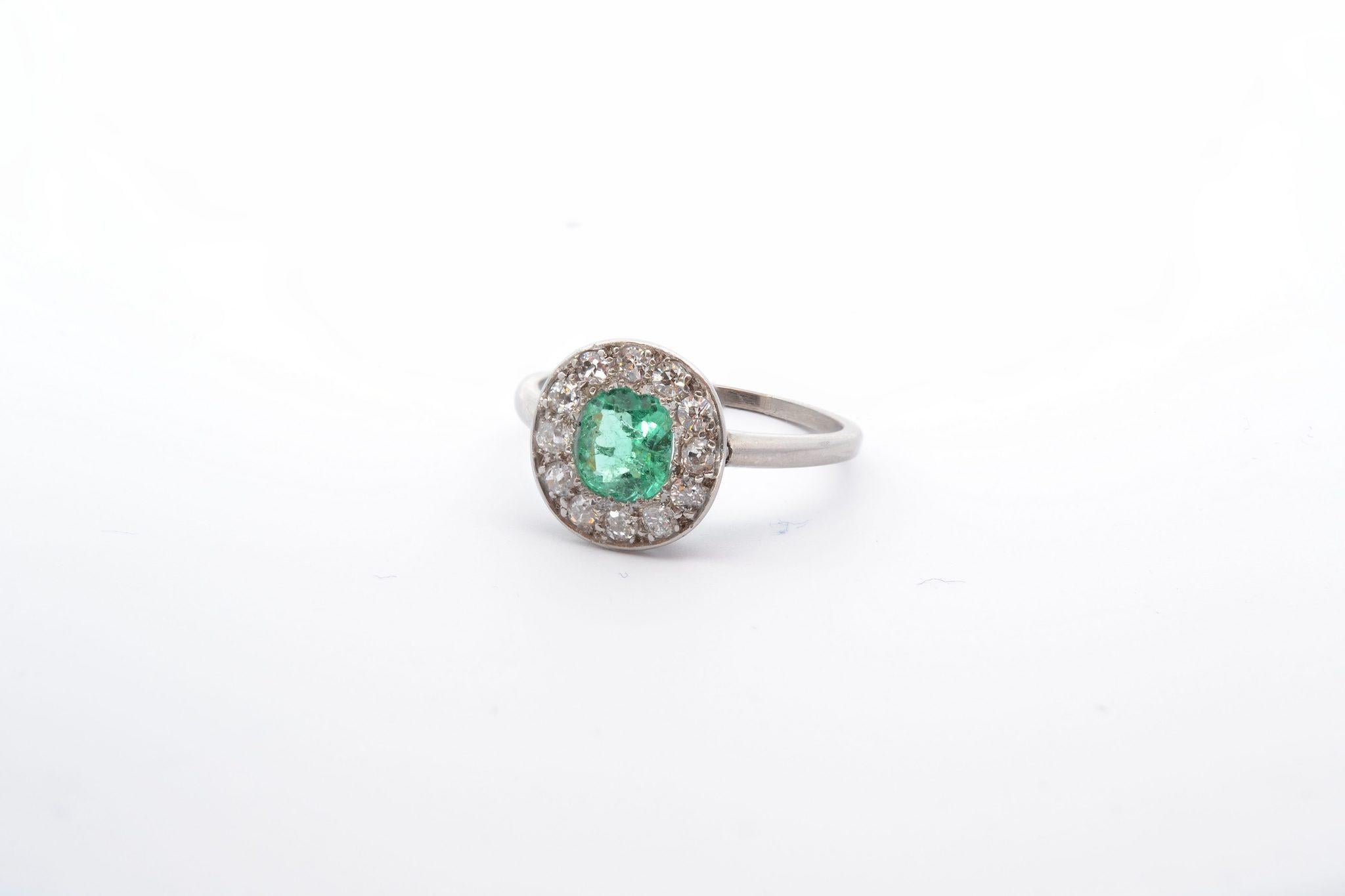 Round Cut  1 carat emerald and 12 diamonds ring from 1920 For Sale