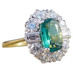 1 Carat Emerald and Diamond Cluster Engagement Ring