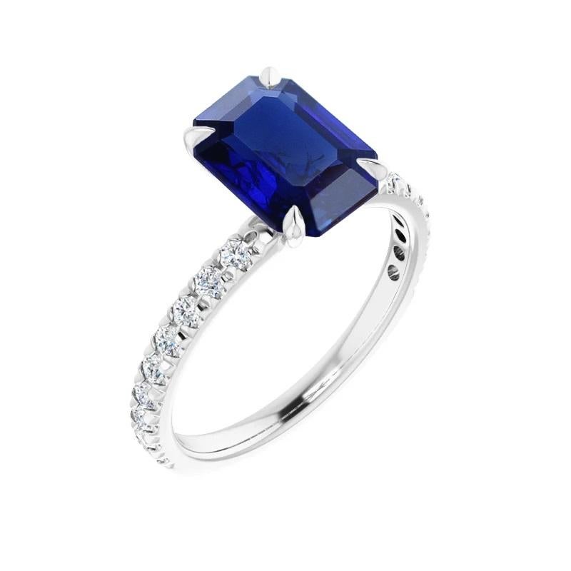 A beautiful emerald-cut no-heat one-carat unheated sapphire and diamond engagement ring by Gem + Honey. This jewel is centered with a vivid blue sapphire from Burma (Myanmar), accented with eighteen round brilliant-cut natural, Canadamark™ diamonds*