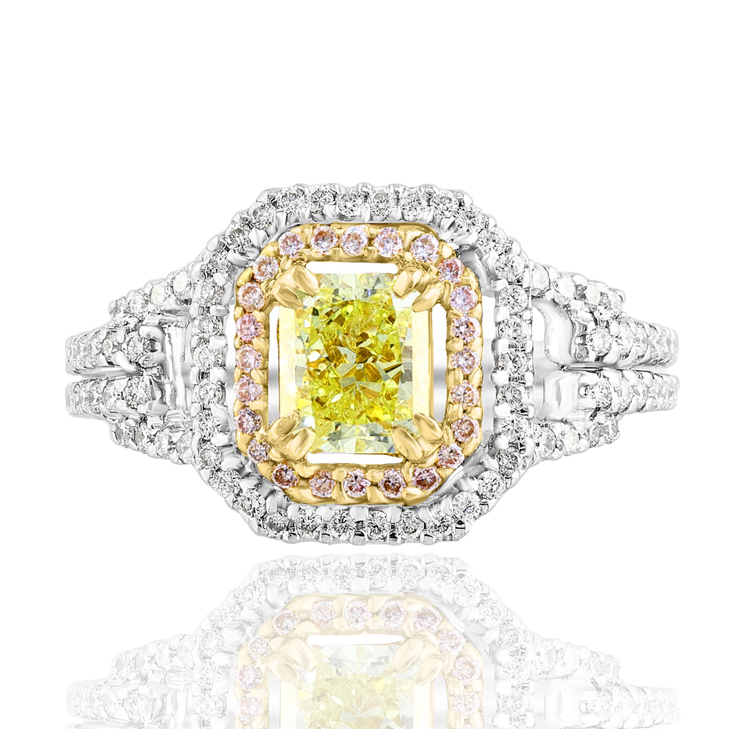A stunning ring showcasing a fancy emerald cut yellow diamond weighing 1.00 carat surrounded by a row of pink diamonds and white diamonds halfway to the shank. Flanking the center stone are the diamonds weighing 0.92 carats in total. Made in 18K mix