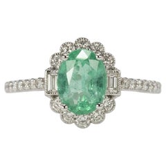 Anello da cocktail con diamante smeraldo da 1 carato e montatura a halo smerlata