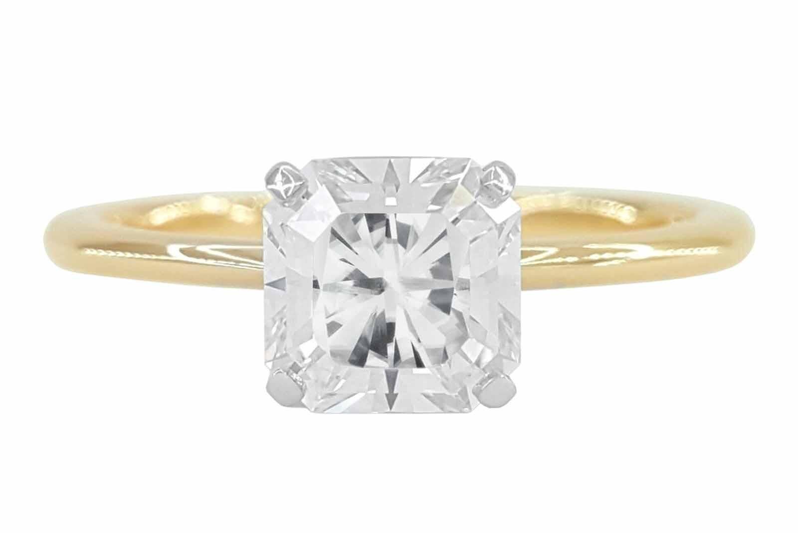 This stunning piece showcases a radiant 1 carat diamond set in a classic 18 k yellow gold solitaire setting. The diamond, boasting an impressive F color grade, embodies near-colorless perfection, emitting a captivating brilliance that catches the