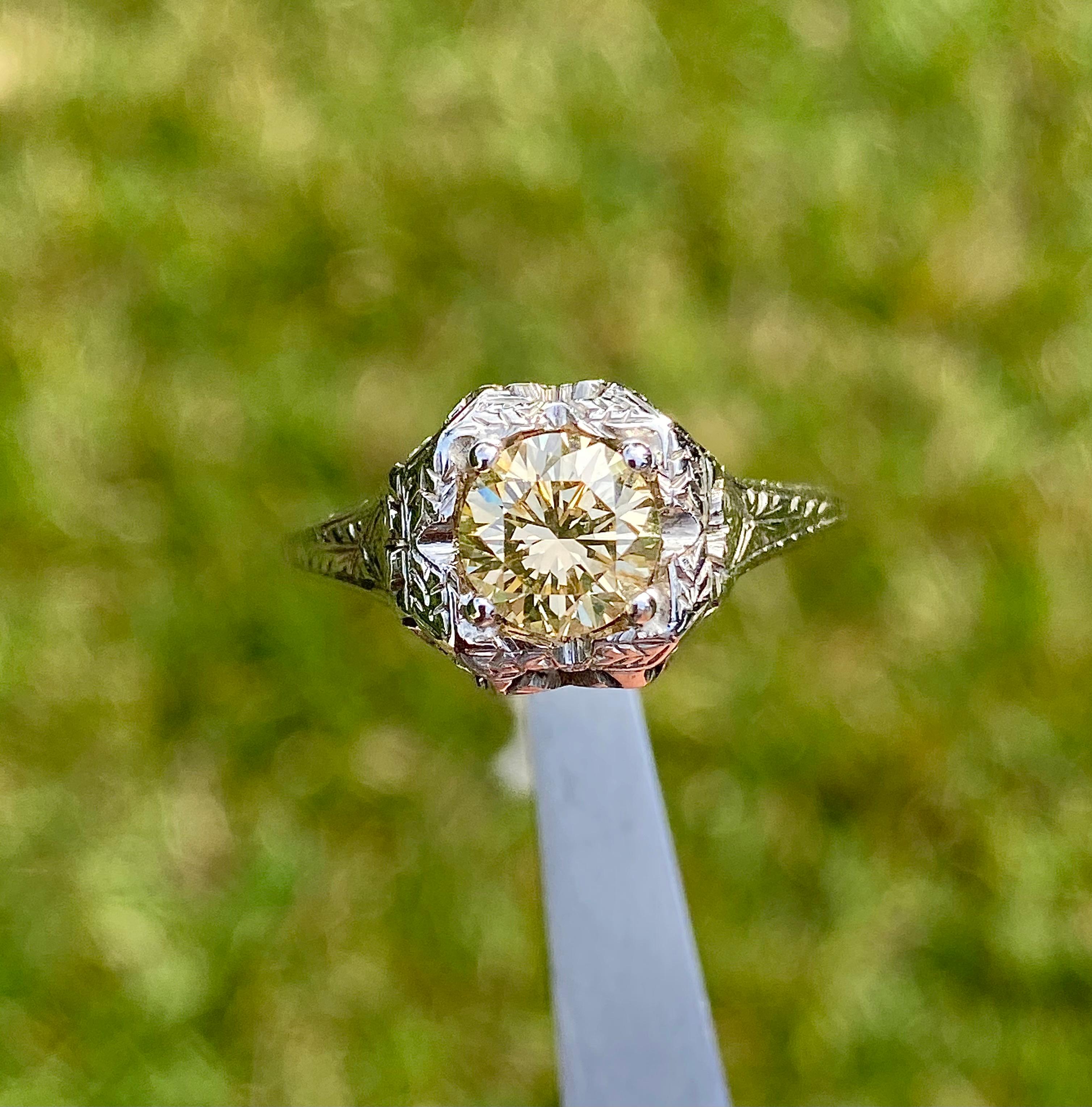 Antique Art Deco platinum ring with natural brown Diamond center stone. Ring setting is an original Art Deco era mounting. The setting was acquired separately and the Diamond was later added by our designers. The ring setting is estimated to date