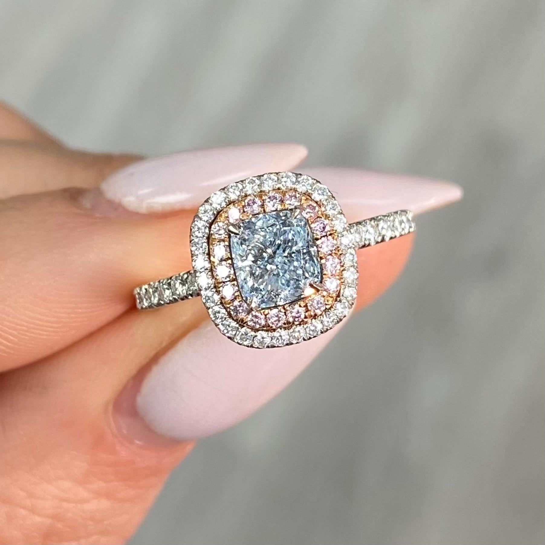 Rare and beautiful 1ct Fancy Light Blue Cushion, full of color and life, sweet blue
100% eye clean
Set in a platinum and Rose Gold ring with Pink and White surrounding diamonds
This piece can be viewed before purchase in our showroom in NYC or at