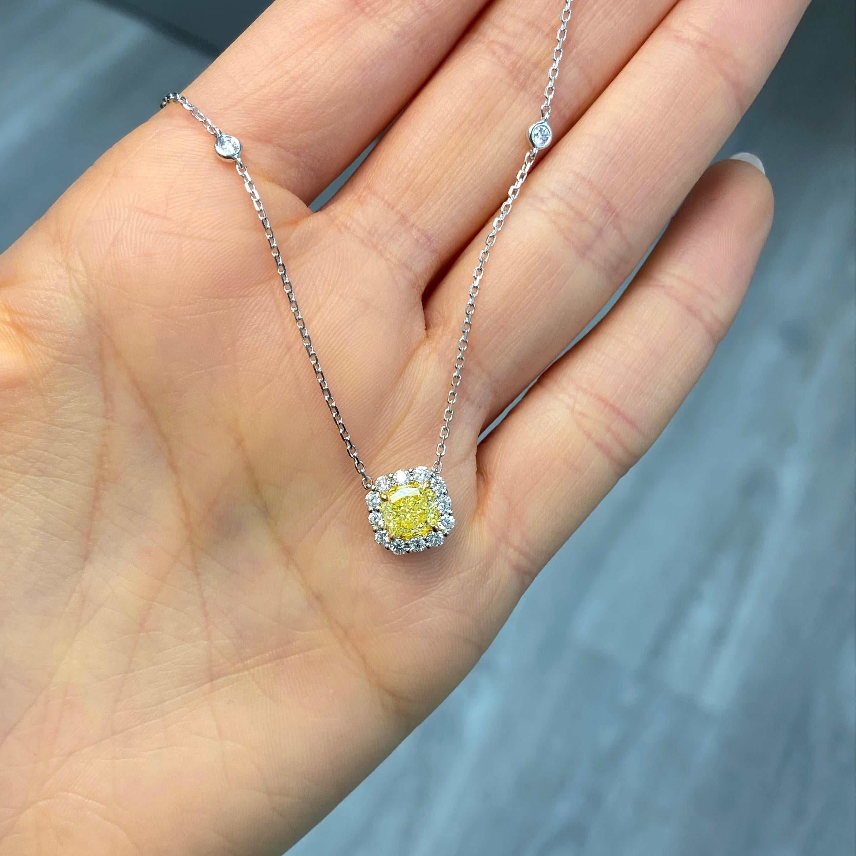 At the heart of this luminous necklace is a 1.22 carat GIA-certified Fancy Light Yellow cushion cut diamond, chosen for its vibrant glow and exceptional VS1 clarity. With Excellent and Very Good cutting, the diamond radiates with brilliance and fire