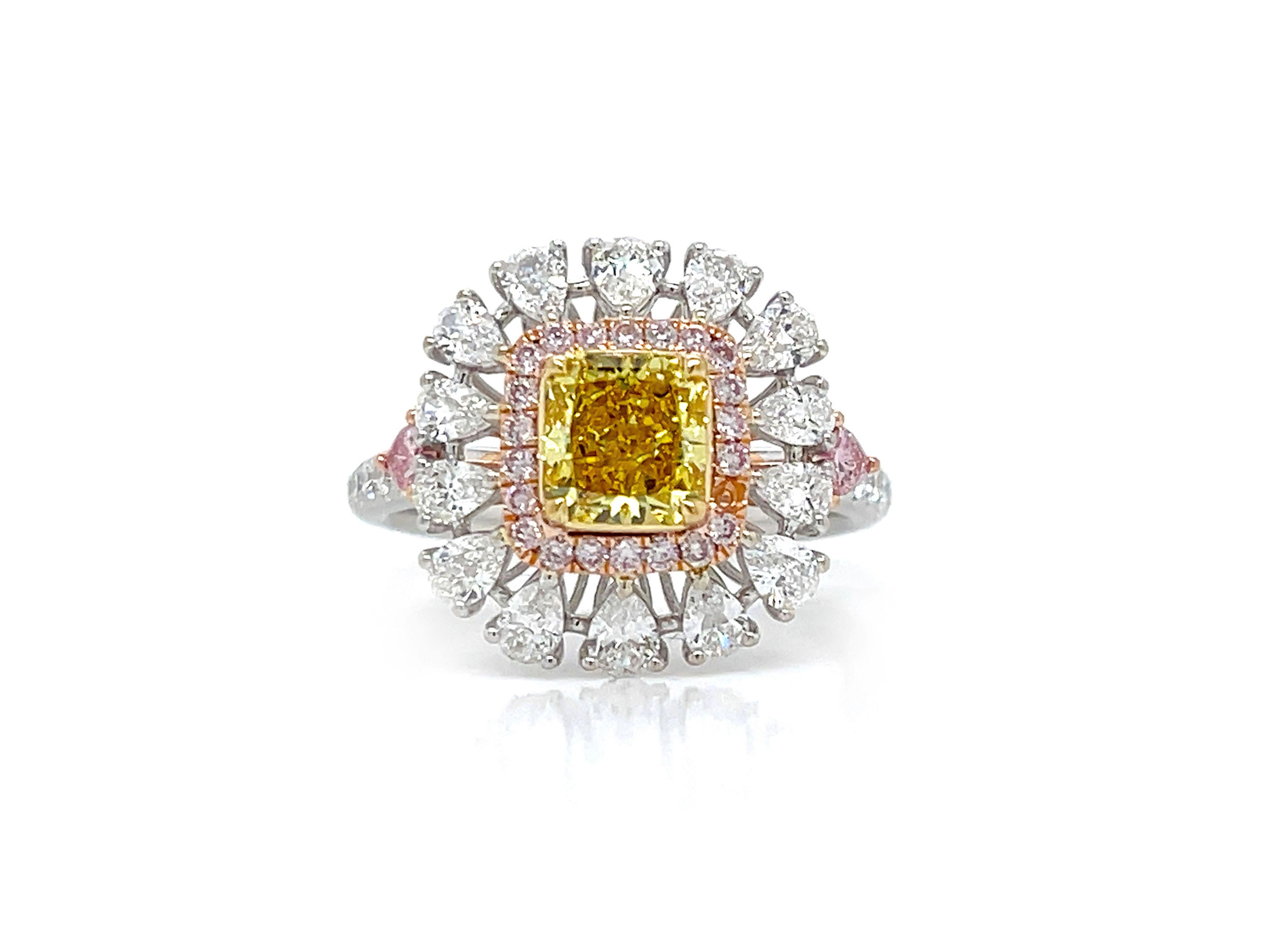A gorgeous Engagement Cocktail ring Showcasing 1.02 Carat radiant cut Fancy Vivid Yellow Diamond, GIA Certified as VS2 clarity. with colorful accents of 0.12 carat Fancy Pink heart shaped cut on the sides offer a vibrant take. Surrounding the center