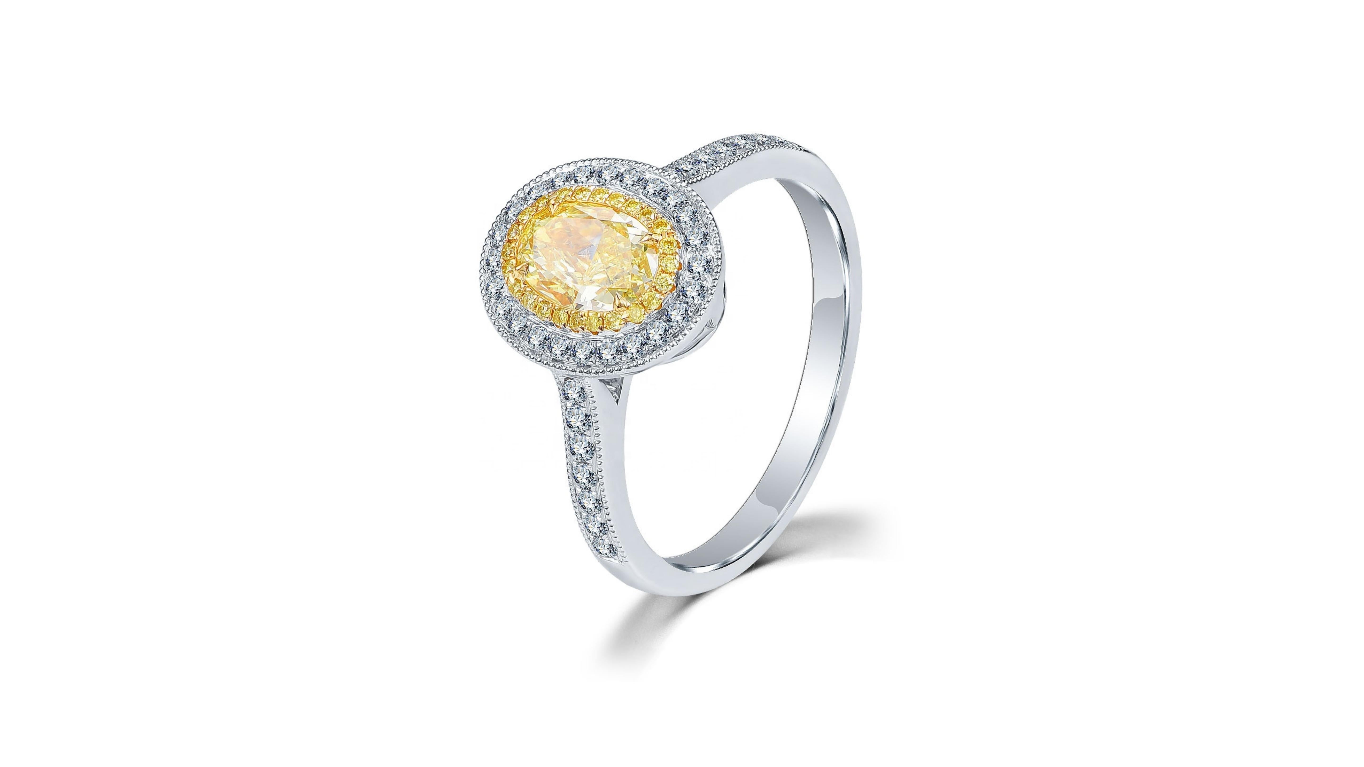 
This 1 Carat Fancy Yellow Diamond Ring Oval  cut with 46 white diamonds including  a set down each side of the band.  Its in 18 Karat White Gold
If you are looking for anything specific let us know as we can have any custom made. 

Do let us know