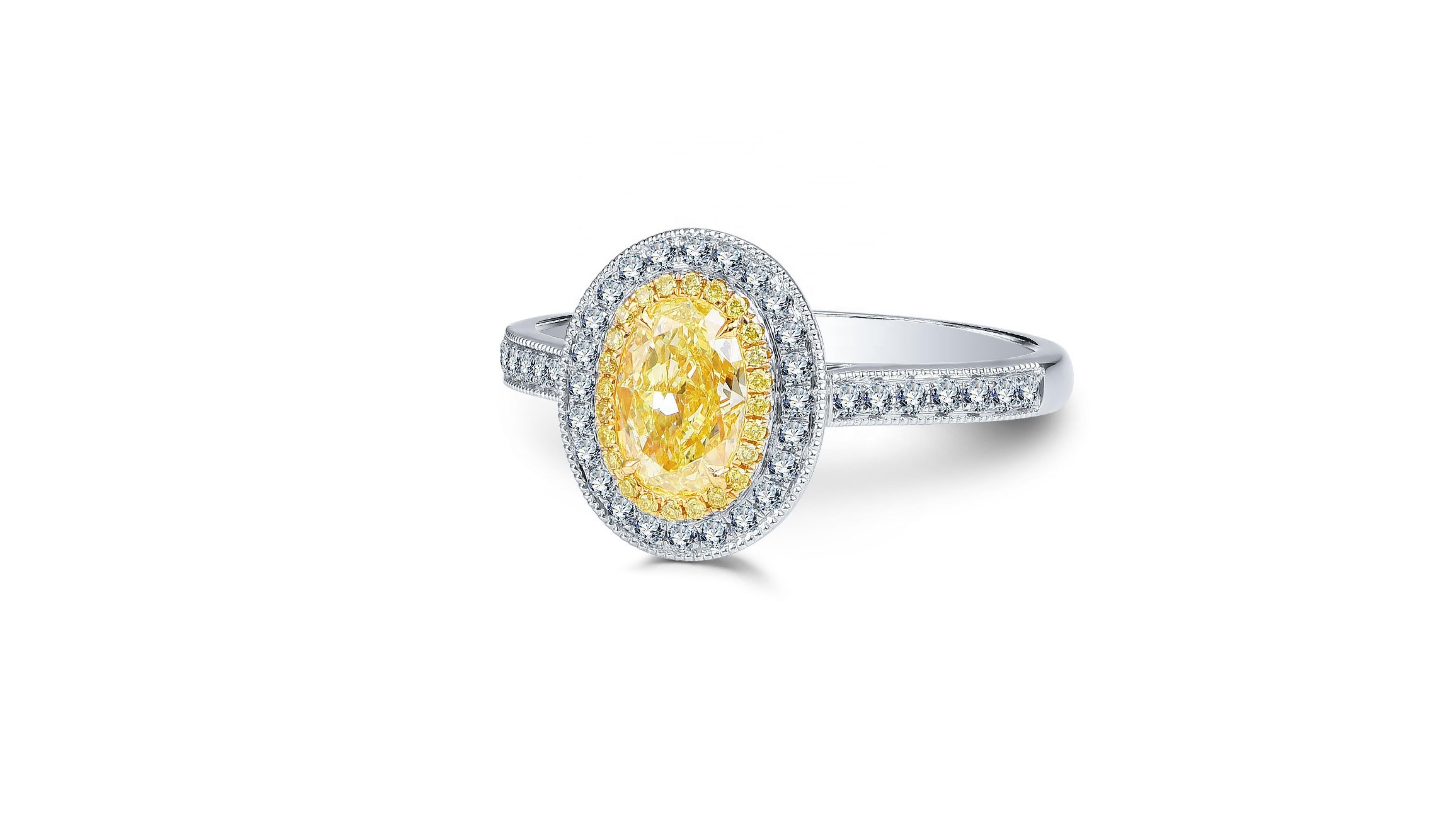 Contemporary 1 Carat Fancy Yellow Diamond Ring 18 Karat White Gold For Sale