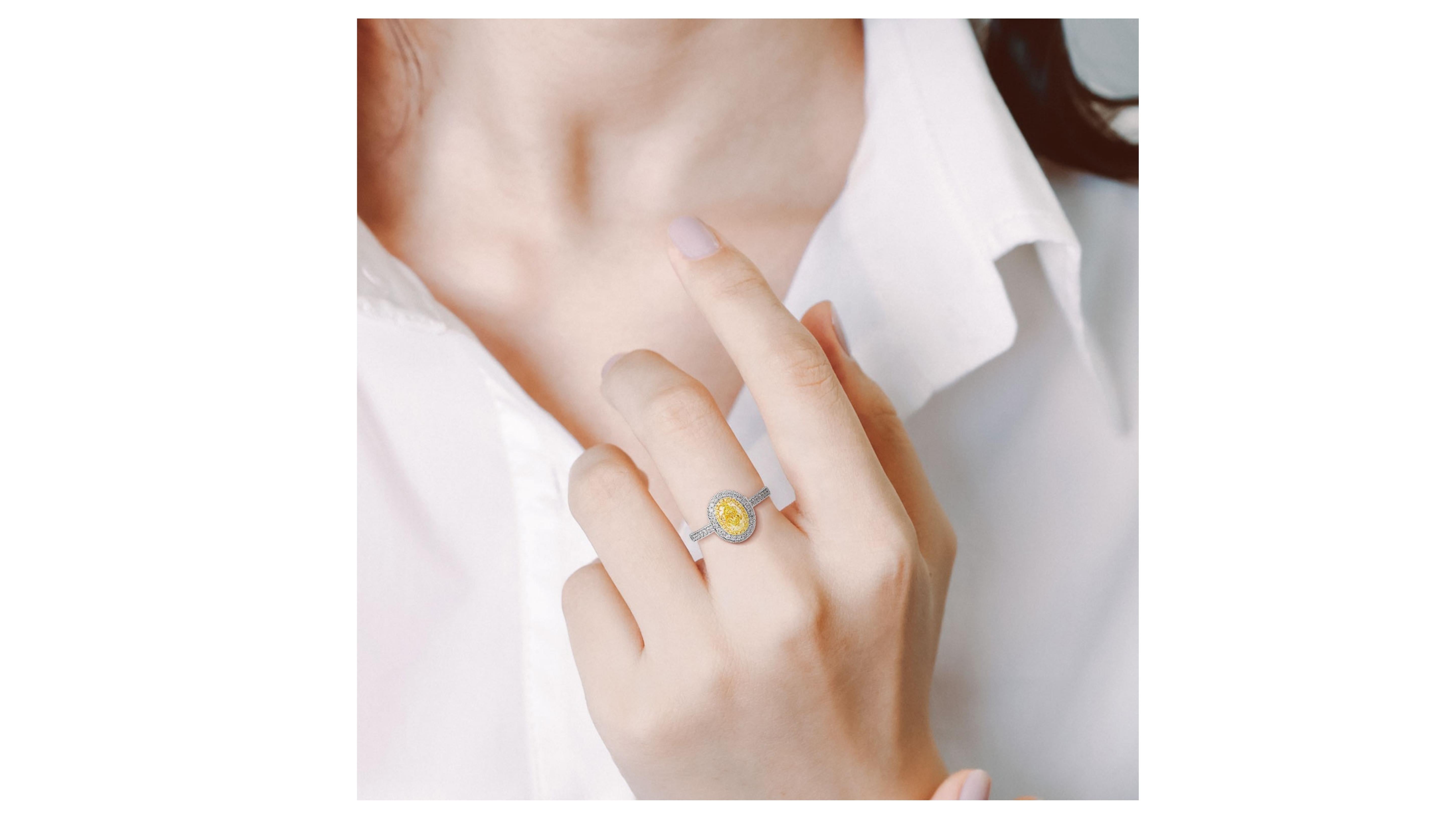 Oval Cut 1 Carat Fancy Yellow Diamond Ring 18 Karat White Gold For Sale