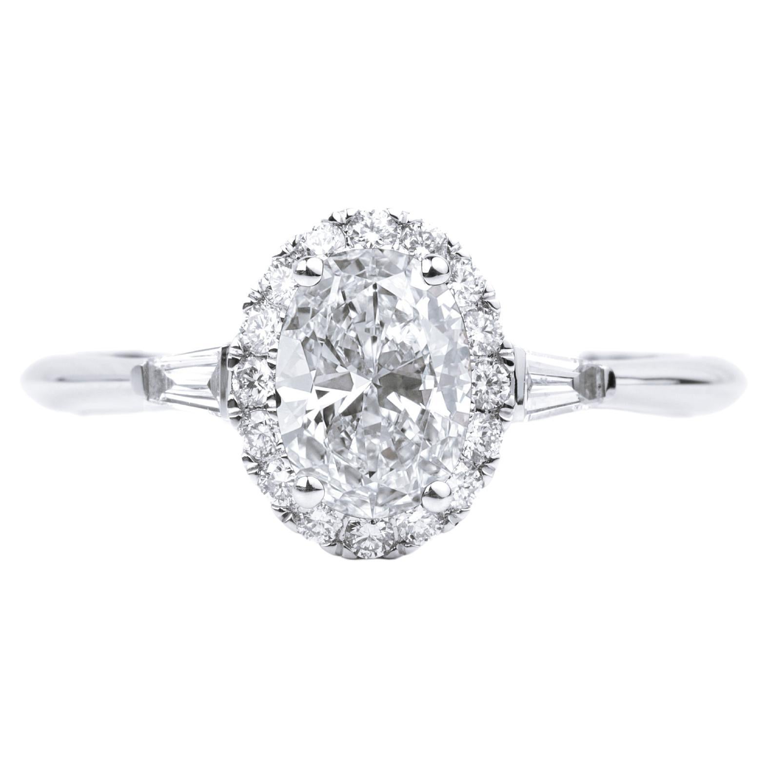 GIA Report Certified 1 Carat E VS Oval Cut Diamond Engagement Ring with Baguette en vente