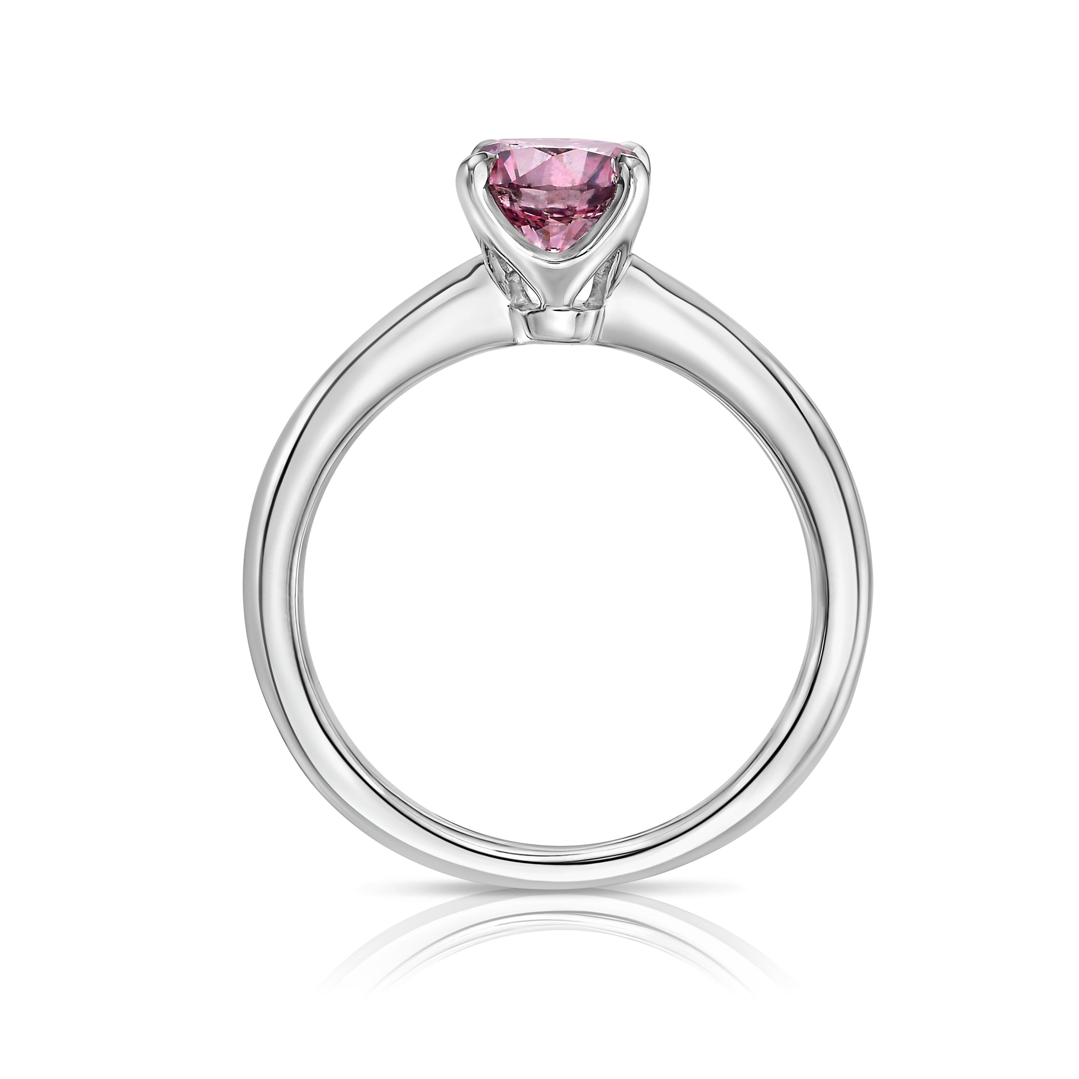 Discover the unparalleled beauty of this GIA-certified 1.00-carat Fancy Intense Pink diamond, a rare and highly sought-after gem in a brilliant round cut. With an extraordinary saturation of pink color, this diamond is a true marvel, offering a