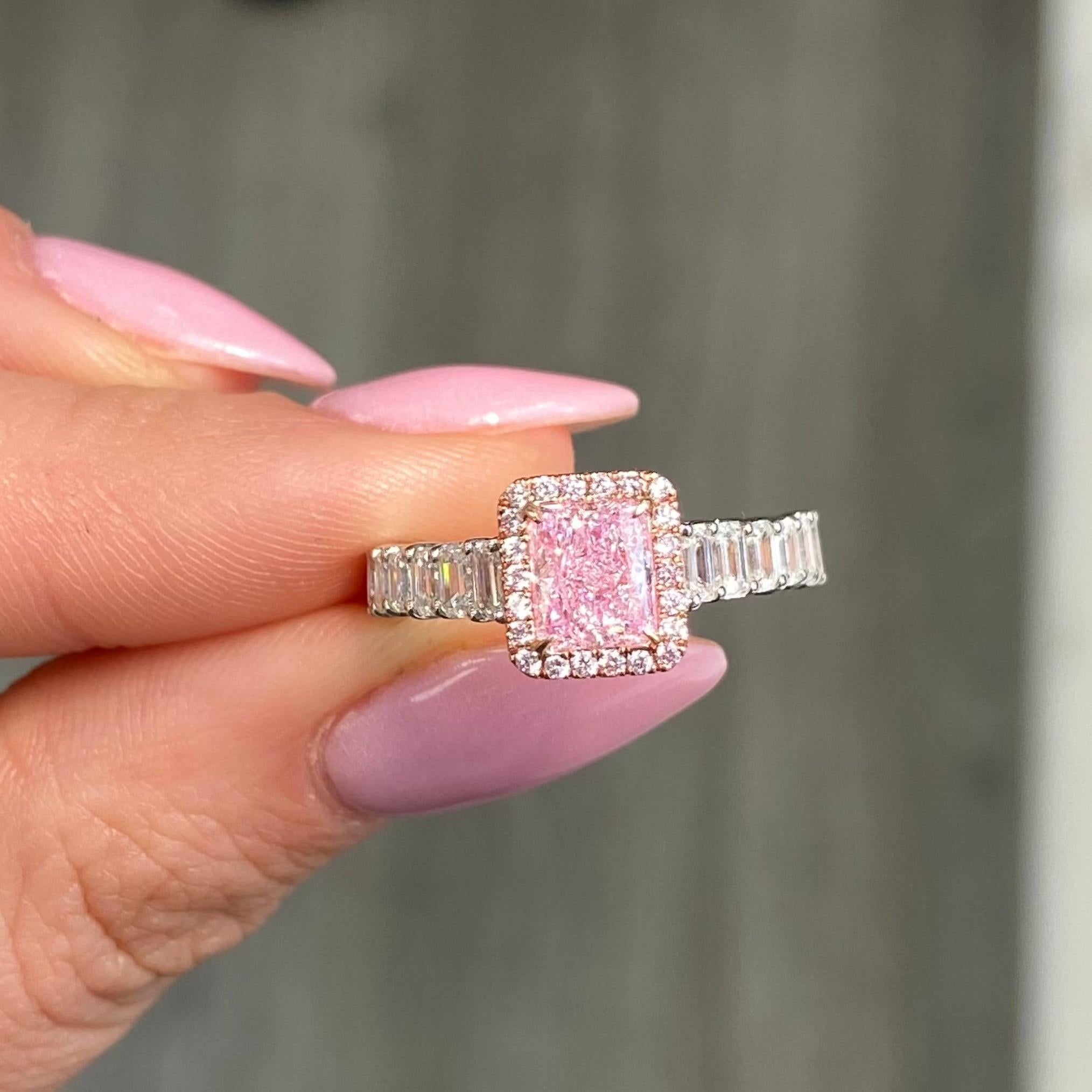 1.09 Carat Center Diamond
Light Pink Elongated Radiant
VS2 Clarity
Excellent, Very Good Cutting
GIA Certified Pink Diamond
Surrounded by 1.33 Carats of natural white diamonds
Set in 18k White Gold
Handmade in NYC

This piece can be viewed before