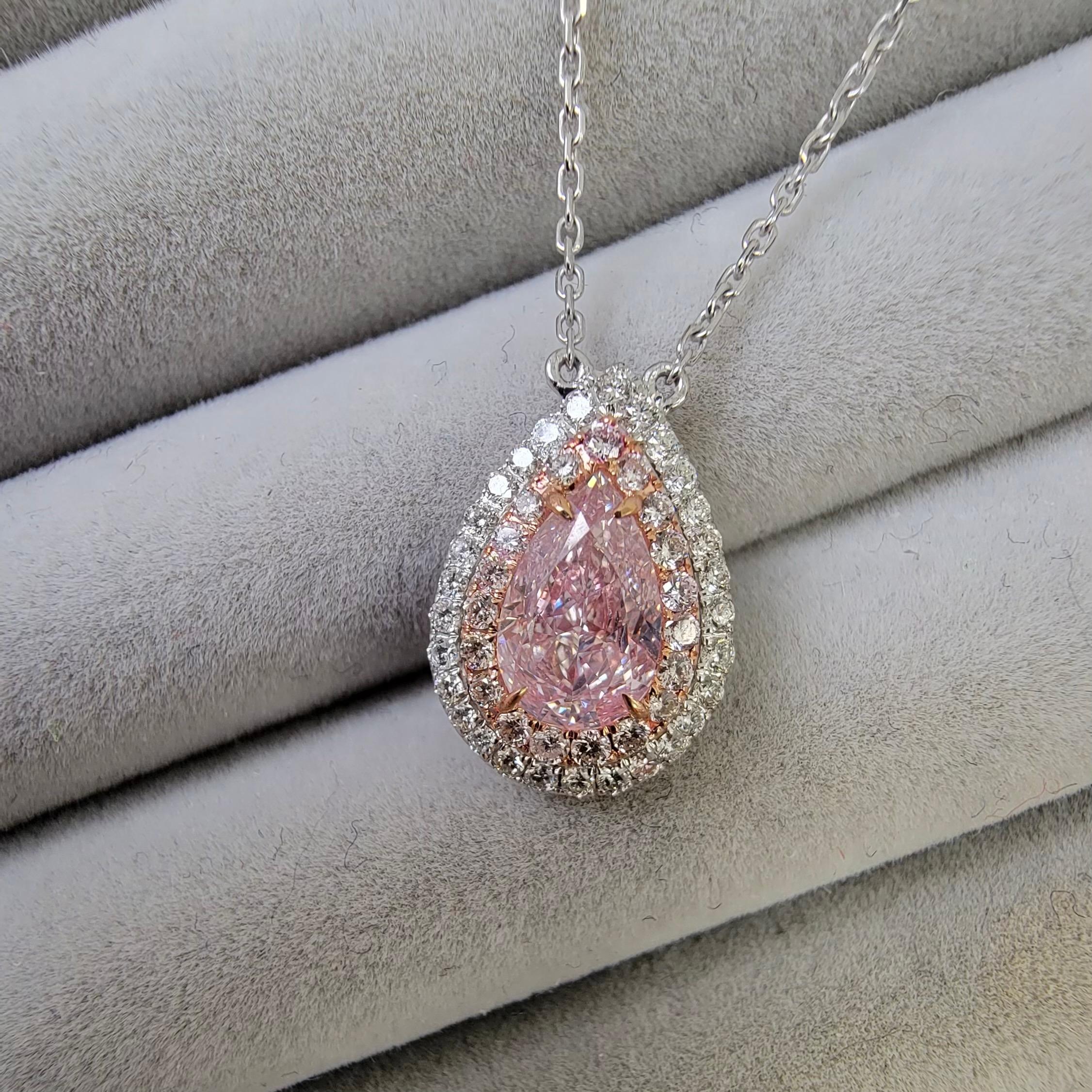 1.02 Carat Center
GIA Light Pink-Brown
Pear Shape Diamond
SI1 Clarity 
0.32 Carats of Surrounding Diamonds
18 Inch Chain
Crafted in 18k Gold
Handmade in NYC
GIA Certified Diamond

This piece can be viewed before purchase in our showroom in NYC, or