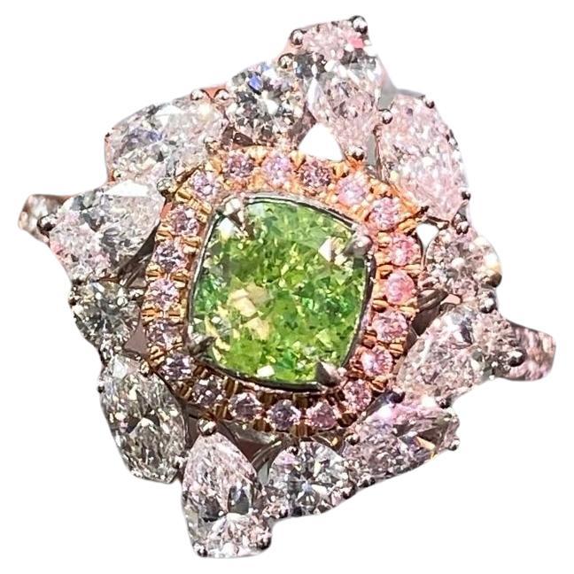 1.03 Carat center cushion cut diamond
Fancy Intense Yellow-Green
'Strong green fluorescence' attributing to the vibrant green hue
I1 Clarity
1.53 Carats mixed shape white diamond halo
GIA Certified green diamond
Crafted in 18k White Gold
Handmade in