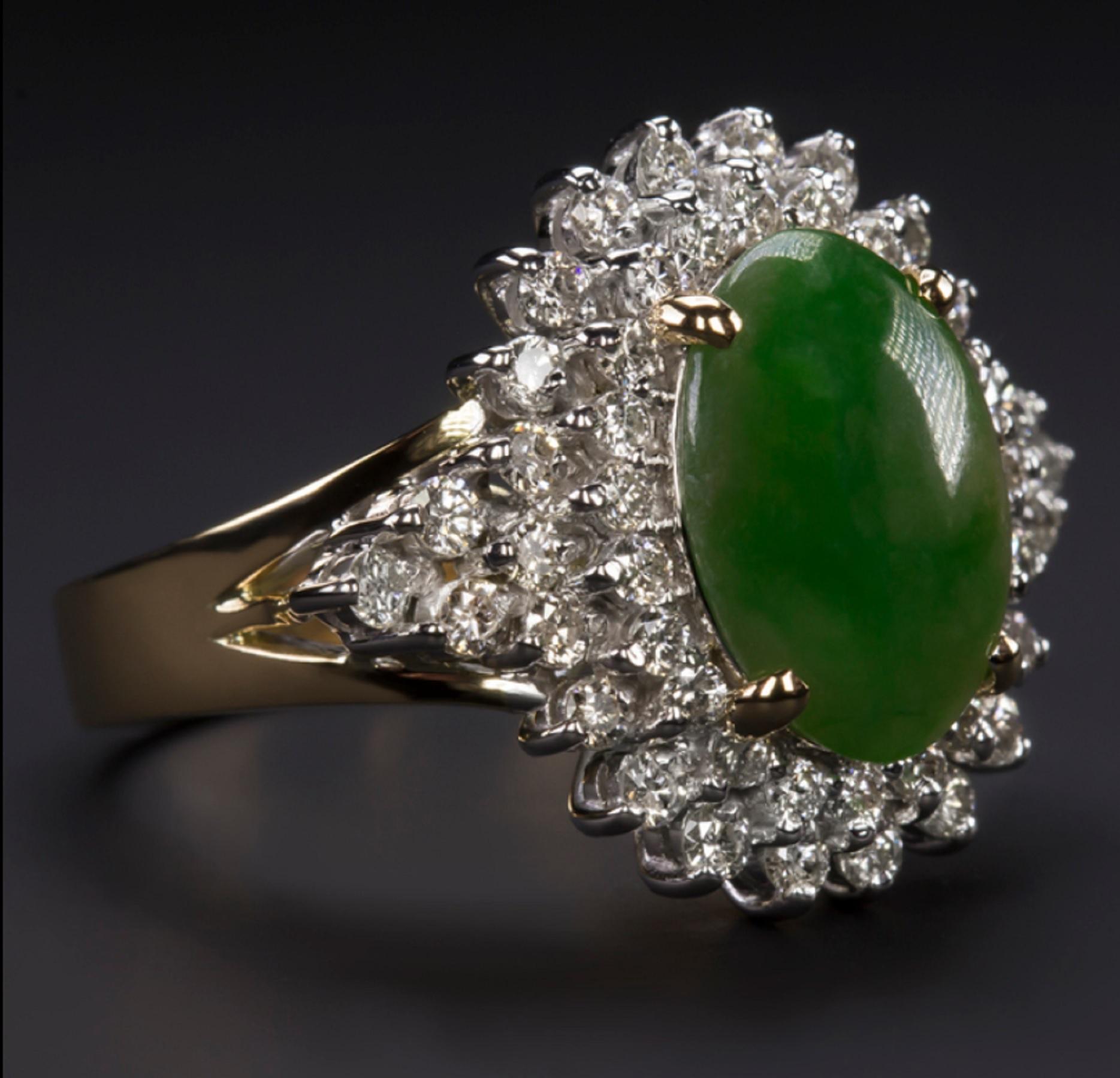  eye-catching original vintage cocktail ring features a gorgeous jade cabochon surrounded by a double halo of vibrant natural diamonds. Measuring 17.5mm across, the ring has a large, statement look! Totaling 1 carat, the diamonds have a very
