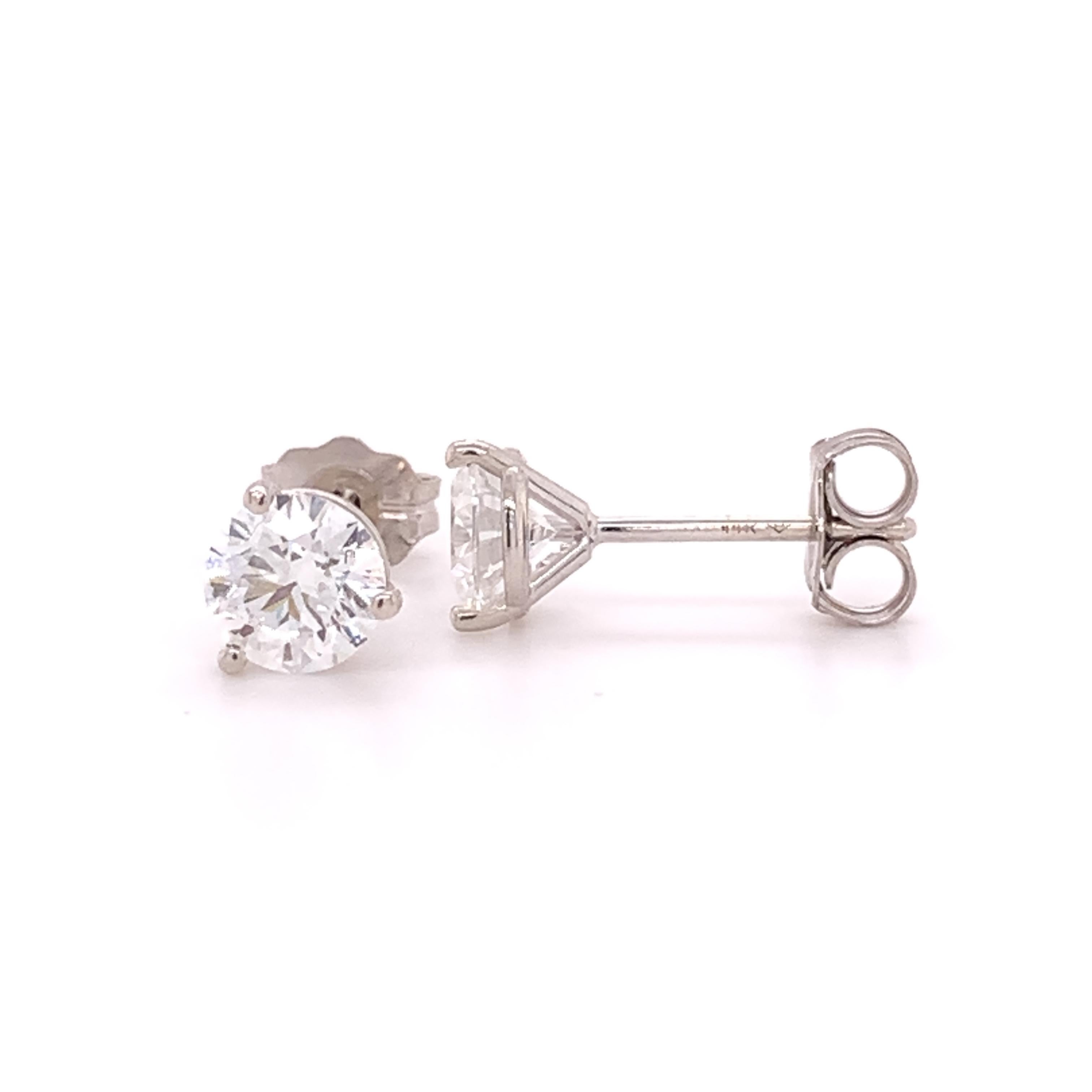 Add an elegant piece to your collection with these three prong round dazzling lab grown diamond earrings. 
(E-F color VS1-VS2 clarity) These earrings total approximately 1.0 carats and are crafted with high polished 14 karat white gold with push
