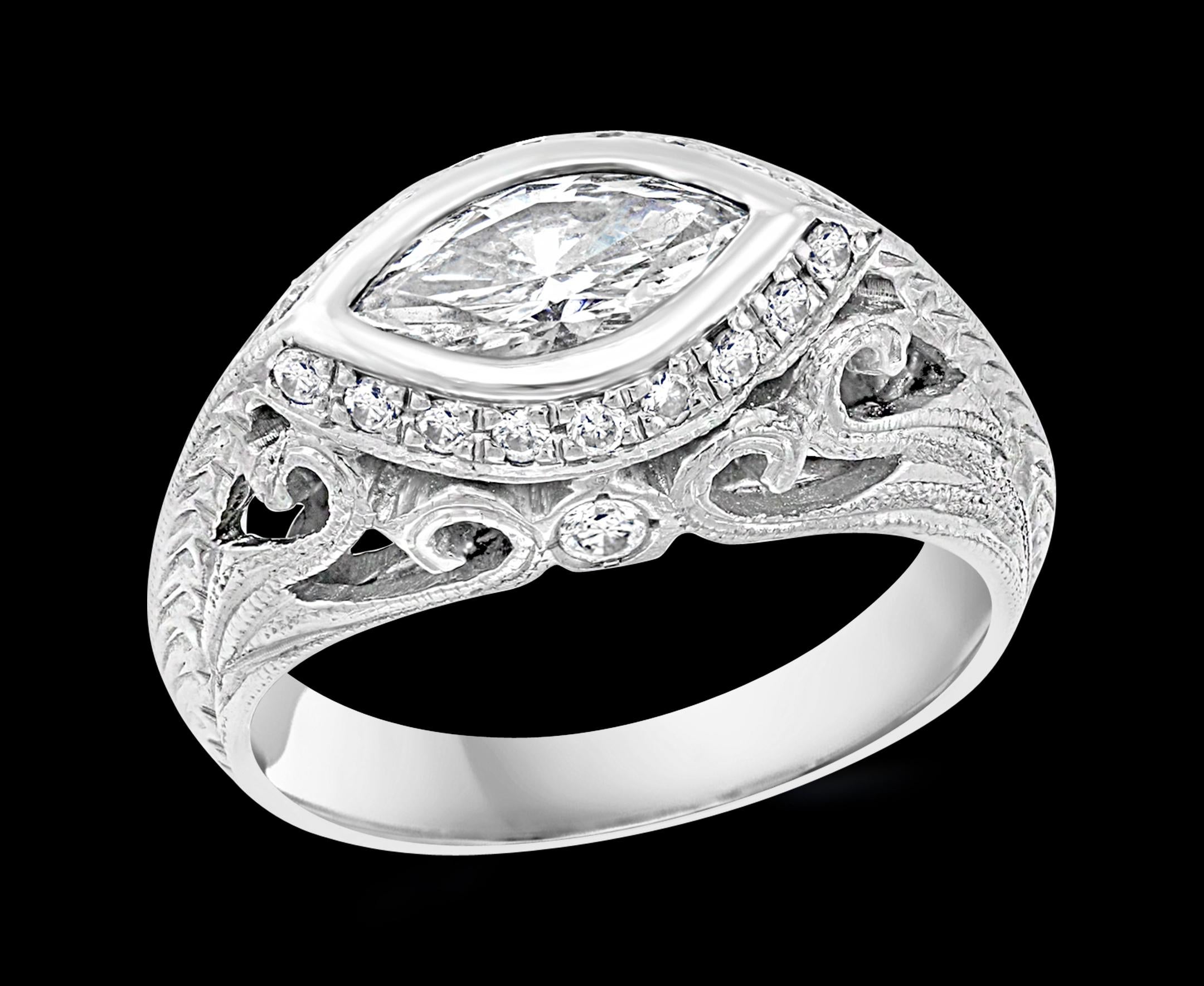 Approximately 1 Carat Marquise Shape Center Diamond Engagement 14 Karat White Gold Ring.
Bezel set
14 K gold Stamped  7 Grams
Eye clean diamond with lots of shine and sparkle
The size of the stone is roughly 8 X 6 which is almost equal to 1.0 ct