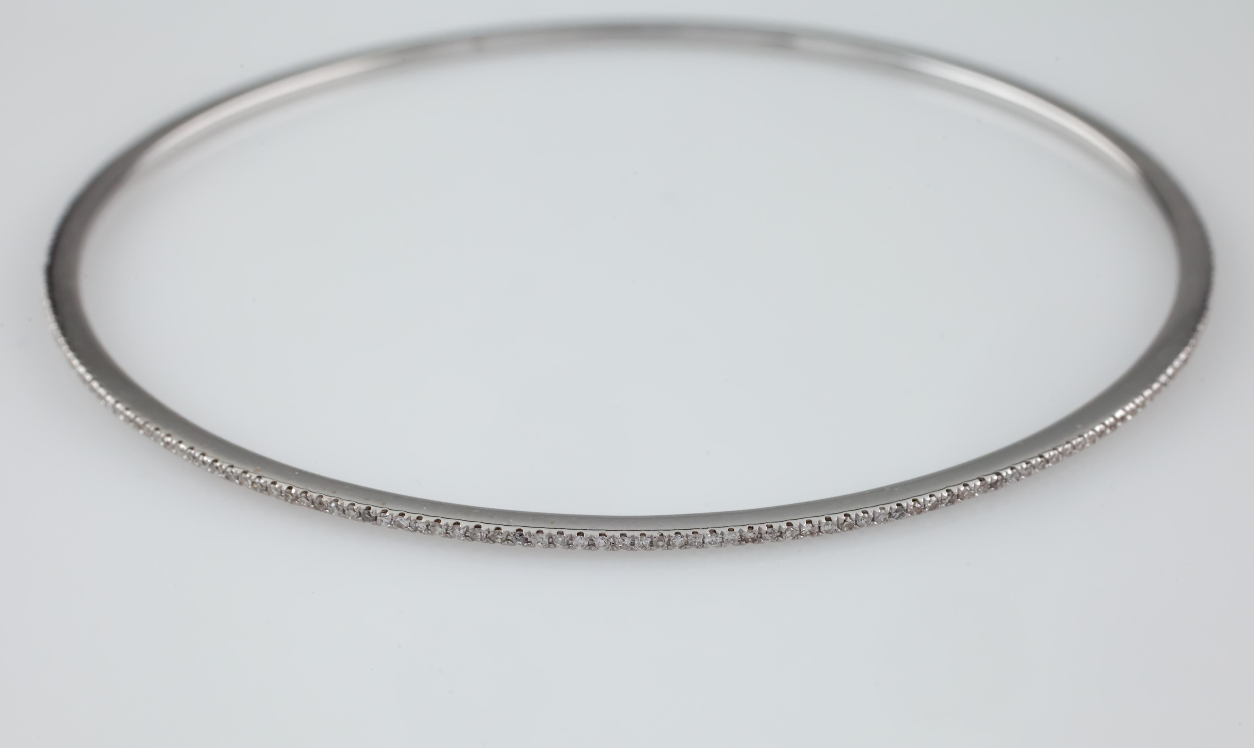 Gorgeous Diamond Bangle Bracelet 
Features an unbroken row of bead set bead diamonds
Total Diamond Weight = Approximately 1 carat
Average Color = G - H
Average Clarity = VS - SI
Inner Circumference (Wrist Fit) = 7