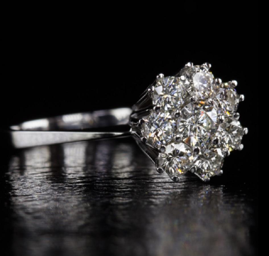 lovely estate cocktail ring with one carat of very well cut diamonds! This delightful midcentury cluster ring has a big look with incredible sparkle. The stones were all very well cut to ideal proportions which allows for dazzling light performance!