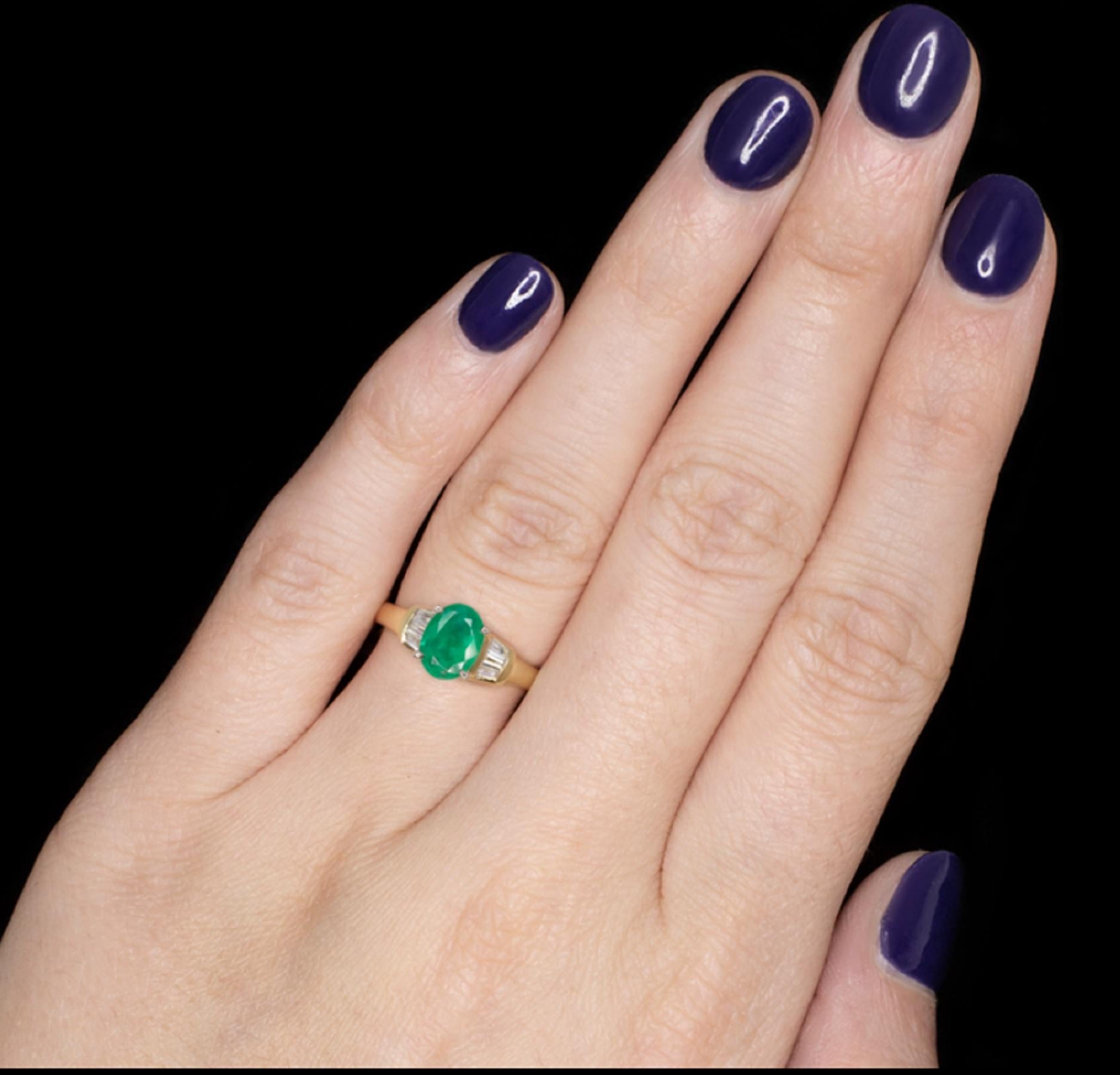  stunning Minas Gerias emerald and diamond ring is absolutely classic in design and rich with vivid color and bright sparkle! The green of the 1.19ct emerald is vibrant and well saturated. It is truly a beautiful color reminiscent of fresh spring