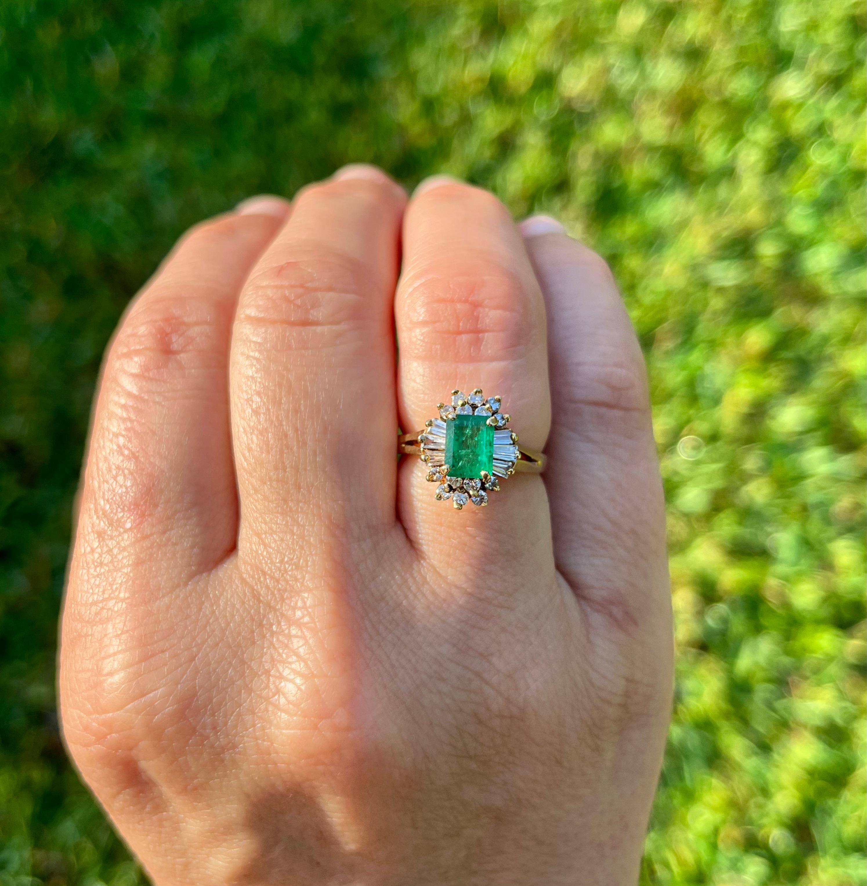 Vintage natural Emerald and natural diamond ring in 14k solid yellow gold. This vibrant Emerald bears excellent color and luster. It's well contrasted by a round and baguette-cut diamond halo. 

Certificate of appraisal included upon request.

Ring