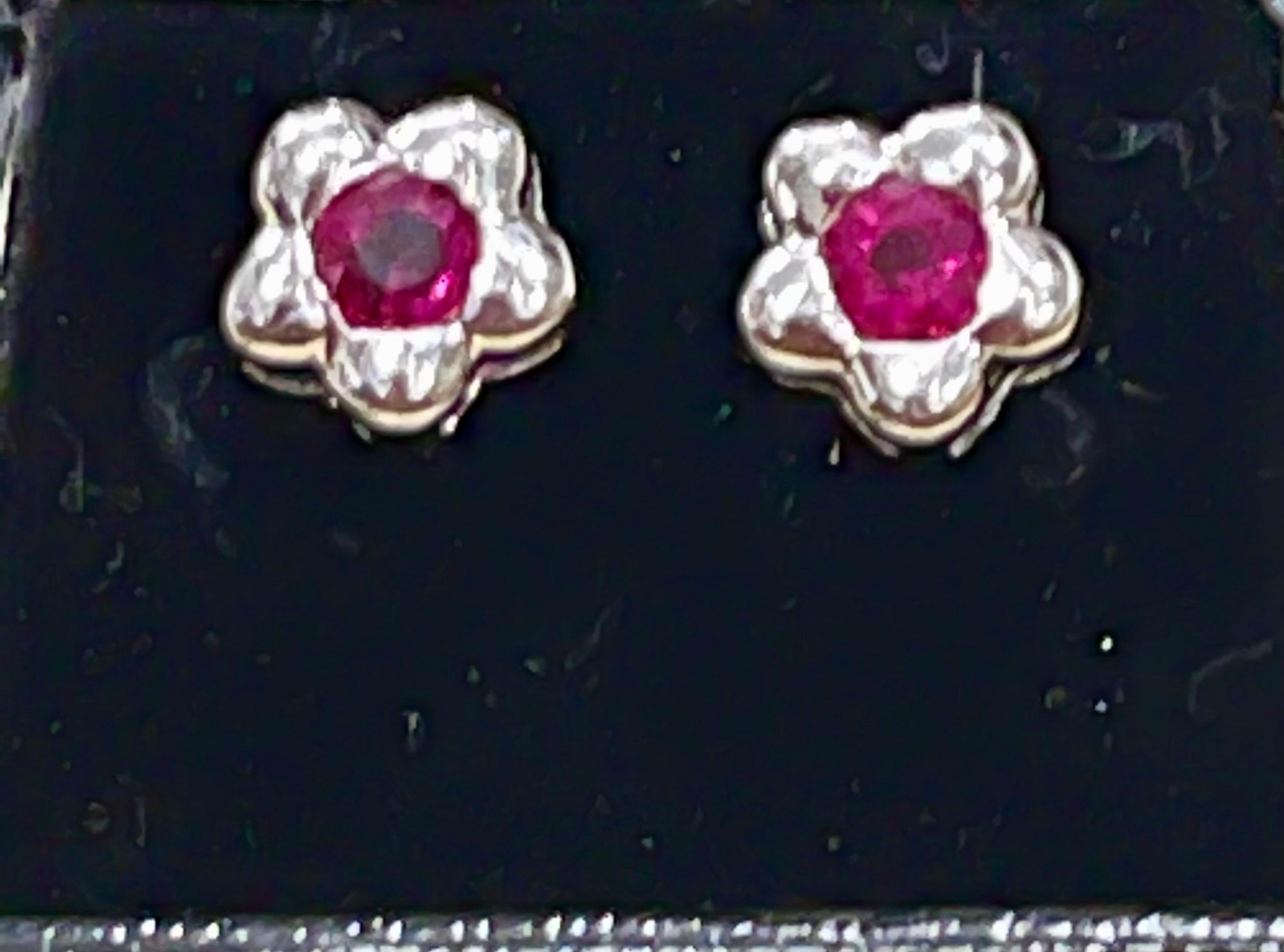 Approximately 1 Carat Natural Round  Ruby Stud Earrings 14 Karat White Gold, Post Back

This exquisite pair of earrings are beautifully crafted with 14 karat white  gold .
Weight of 14 K gold 3.3Grams
Ruby pair 1 ct , Natural ruby of high