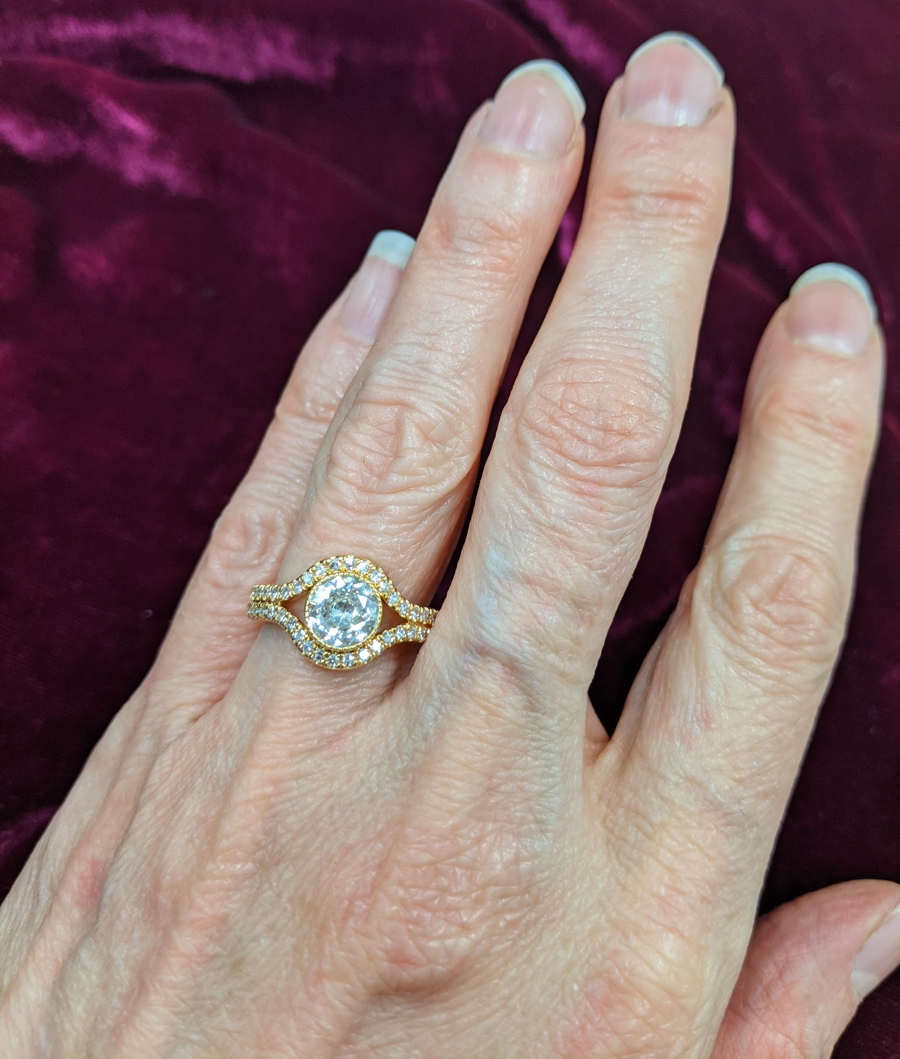 1.02 carat Old European diamond certified as a J color SI-2 clarity (and eye clean to boot!) by GIA.  It sits in an 18KT rose gold mounting.  This ring is a single split shank, but the split allows the diamond to sit in between each shank with 54