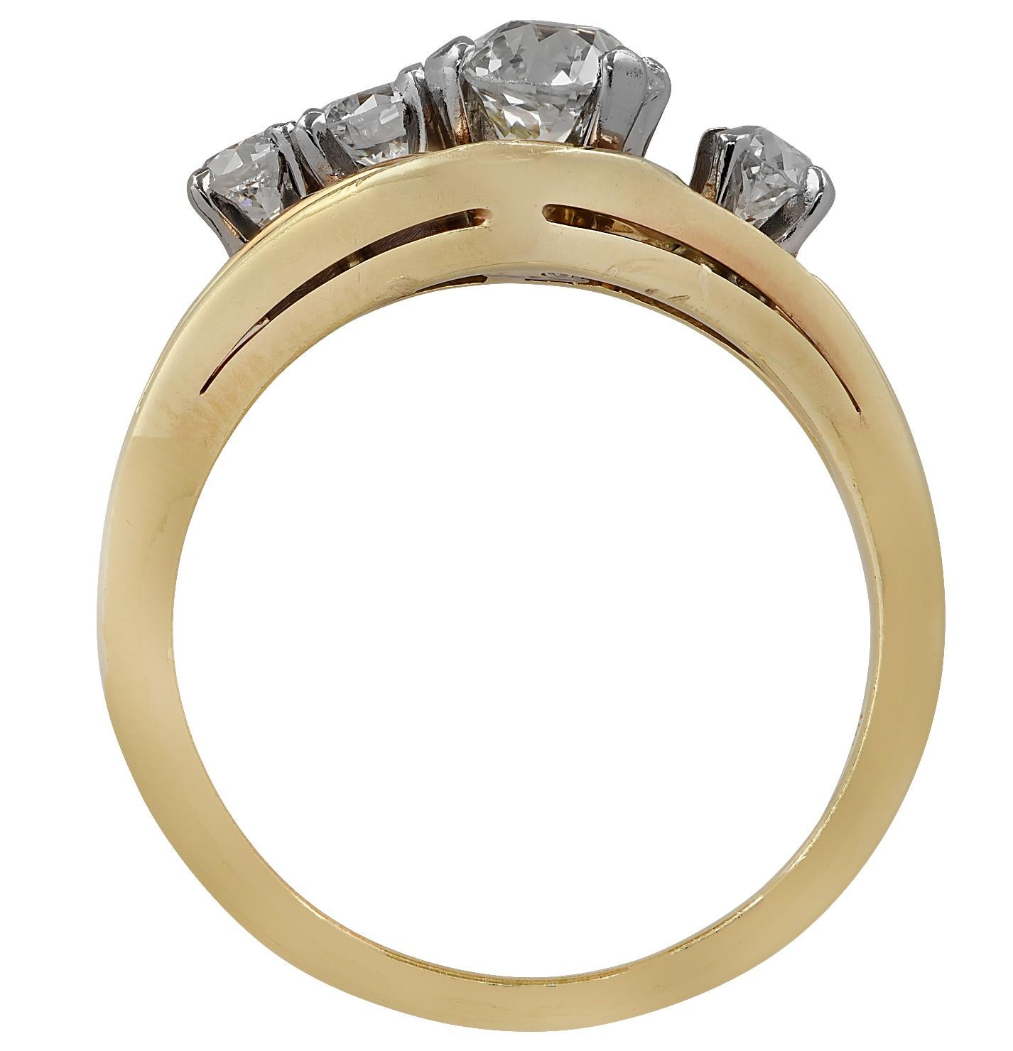 Enchanting ring crafted in 18 karat yellow gold showcasing a Miner Cut Diamond, 2 Old European Cut diamonds and a round brilliant cut diamond weighing approximately 1 carat total, G-I color, VS-SI clarity. This delightful ring measures 8.5 mm at its