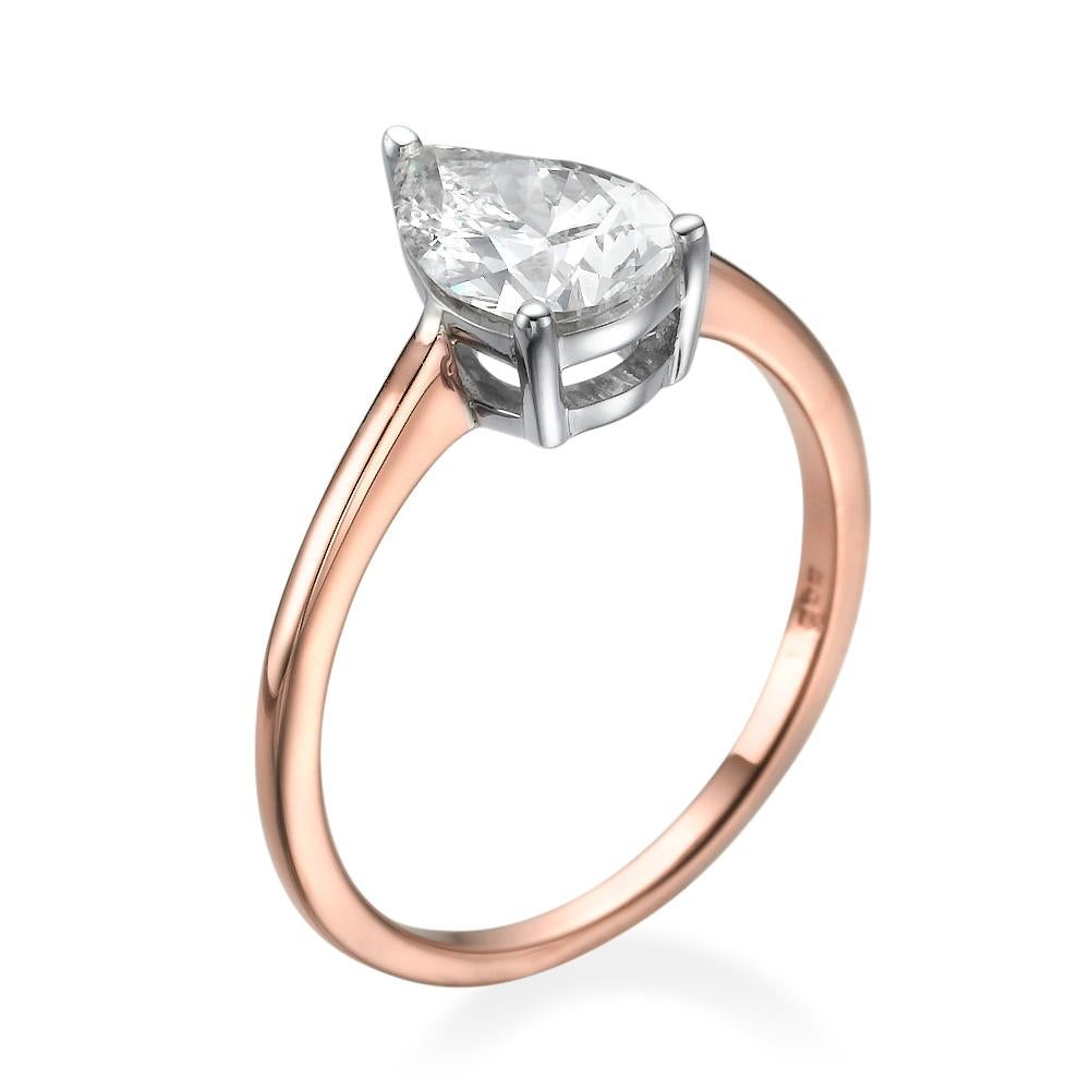 This breathtaking two-tone gold ring features a solitaire GIA certified diamond. Center is of 1 carat pear cut 100% eye clean natural diamond of F-G color and VS2-SI1 clarity. Set in a sleek, 18K rose gold, solitaire ring with a 3-prong setting,