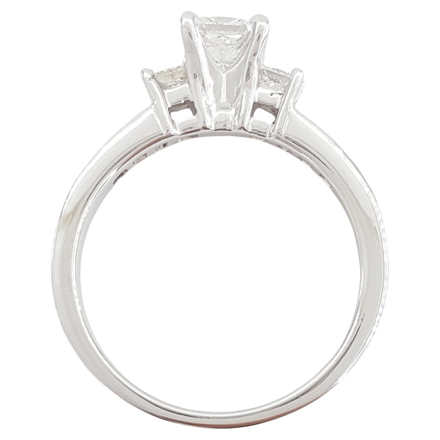 This 14k White Gold Engagement Ring features a total diamond weight of 1 carat, with a central Natural Princess Brilliant Cut Diamond measuring 4.1 x 4.2 mm, F color, and VS1-VS2 clarity. The ring, weighing 3.8 grams and sized 6.75, showcases an