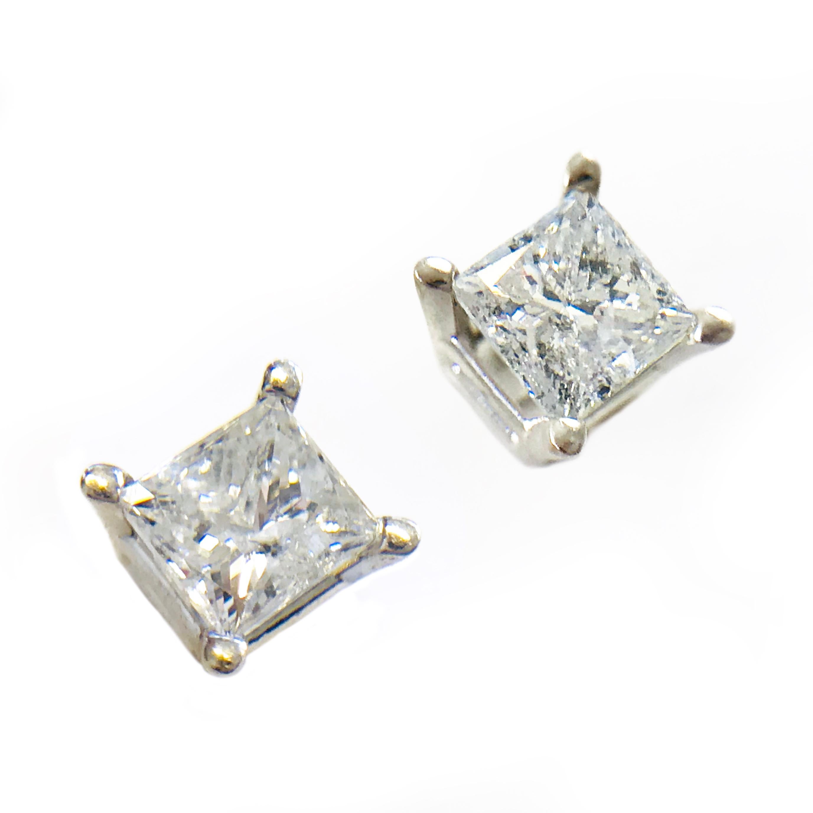 Classic diamond studs. 14 Karat Princess-Cut Diamond Earrings. Four prong set in white gold baskets, the diamonds measure 4.58 x 4.66mm and 4.33 x 4.64mm for a approximate weight of 1.00ctw. The diamonds are I1 (G.I.A.) in clarity and G-H (G.I.A.)