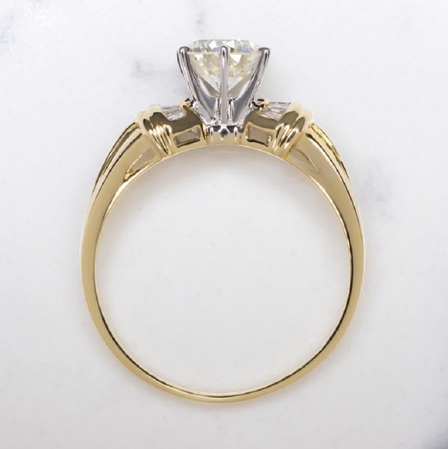 Timelessly elegant with a touch of retro flair, this stunning diamond ring features a dazzlingly brilliant 0.82ct diamond paired with a stylish 18k yellow gold setting. Exceptionally well cut, the center diamond displays absolutely phenomenal