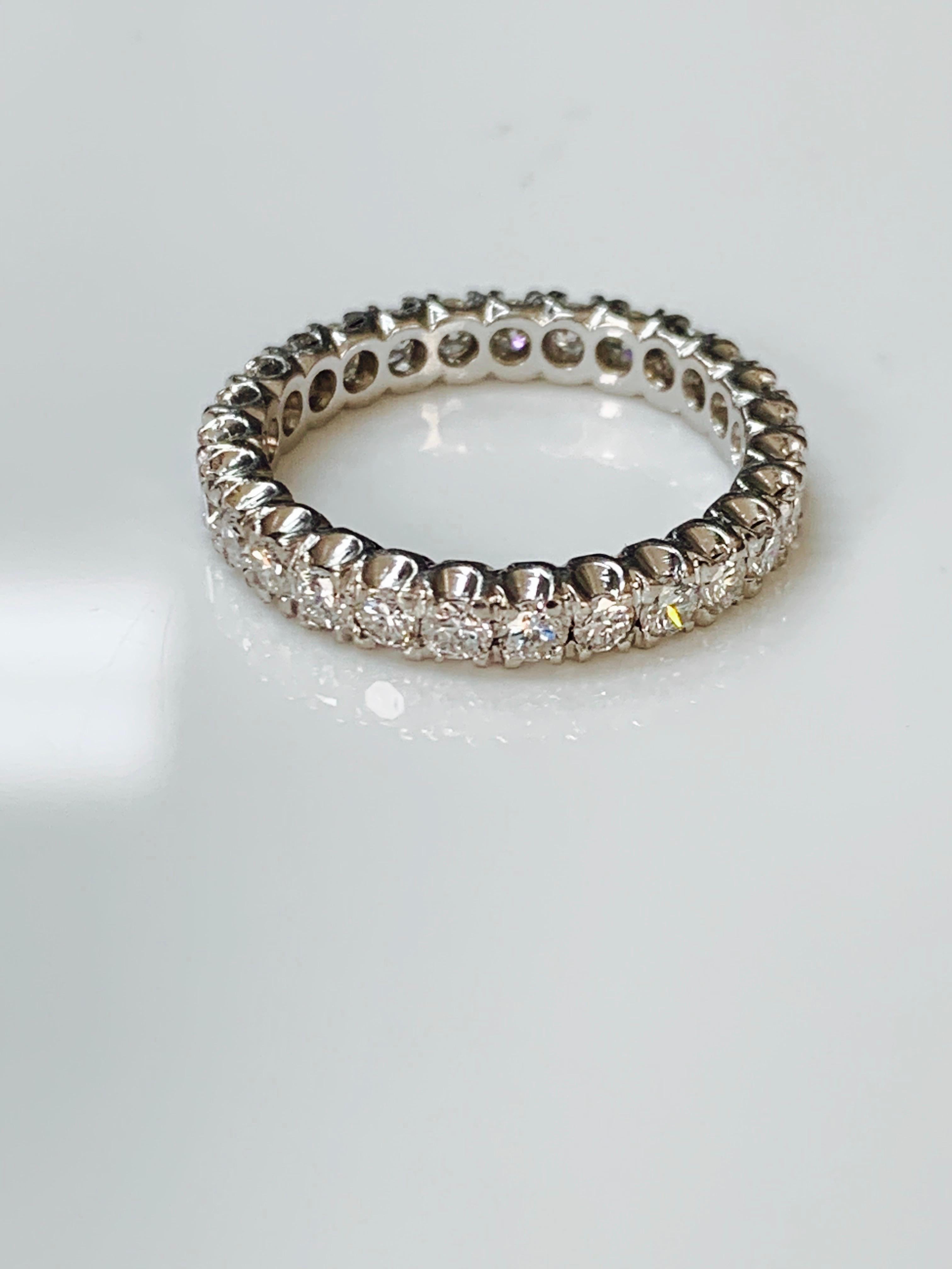 Beautifully handmade 1 carat round brilliant diamond eternity band in white gold. 
The details are as follows :
Diamond weight : 1 carat 
Metal : 18 k white gold 
Ring size : 6
