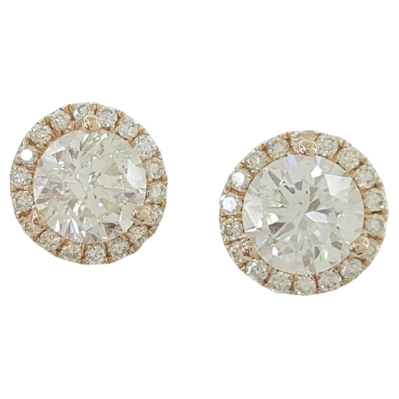Rose Gold Round Halo Stud Earrings with 1.16 ct total weight in Diamonds. 



The Earrings contain 2 Natural Round Brilliant Cut Diamonds Weighing 1.00 ct, I-J in Color, SI3 in Clarity. 



