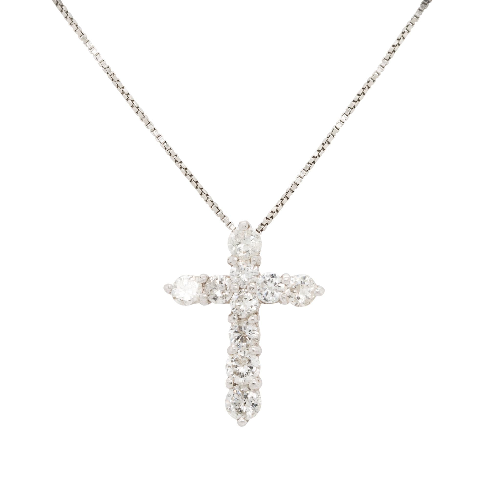Platinum: 1ctw Round Diamond Small Cross Pendant Necklace
Material: 18k White Gold
Diamond Details: Approx. 1ctw of round cut Diamonds. Diamonds are G/H in color and VS in clarity
Pendant Measurements: n15.5mm x 3mm x 20mm
Length: 16 inches