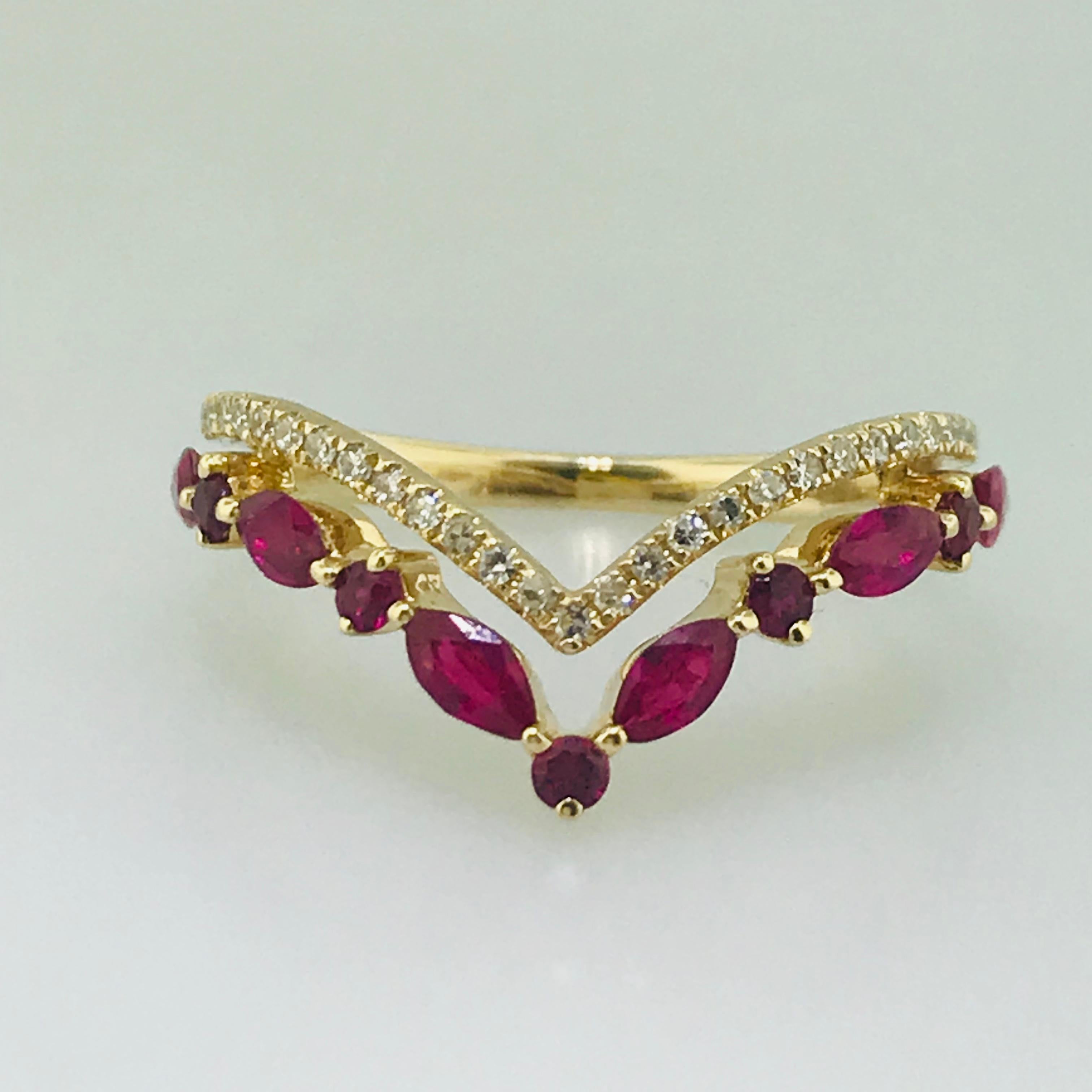 Modern V Band
Meet the diamond and ruby V band. This 14 karat yellow gold v band has such a fun personality! With a round brilliant diamond v design on top of an alternating round and marquise shaped genuine ruby v band, meeting at the back and