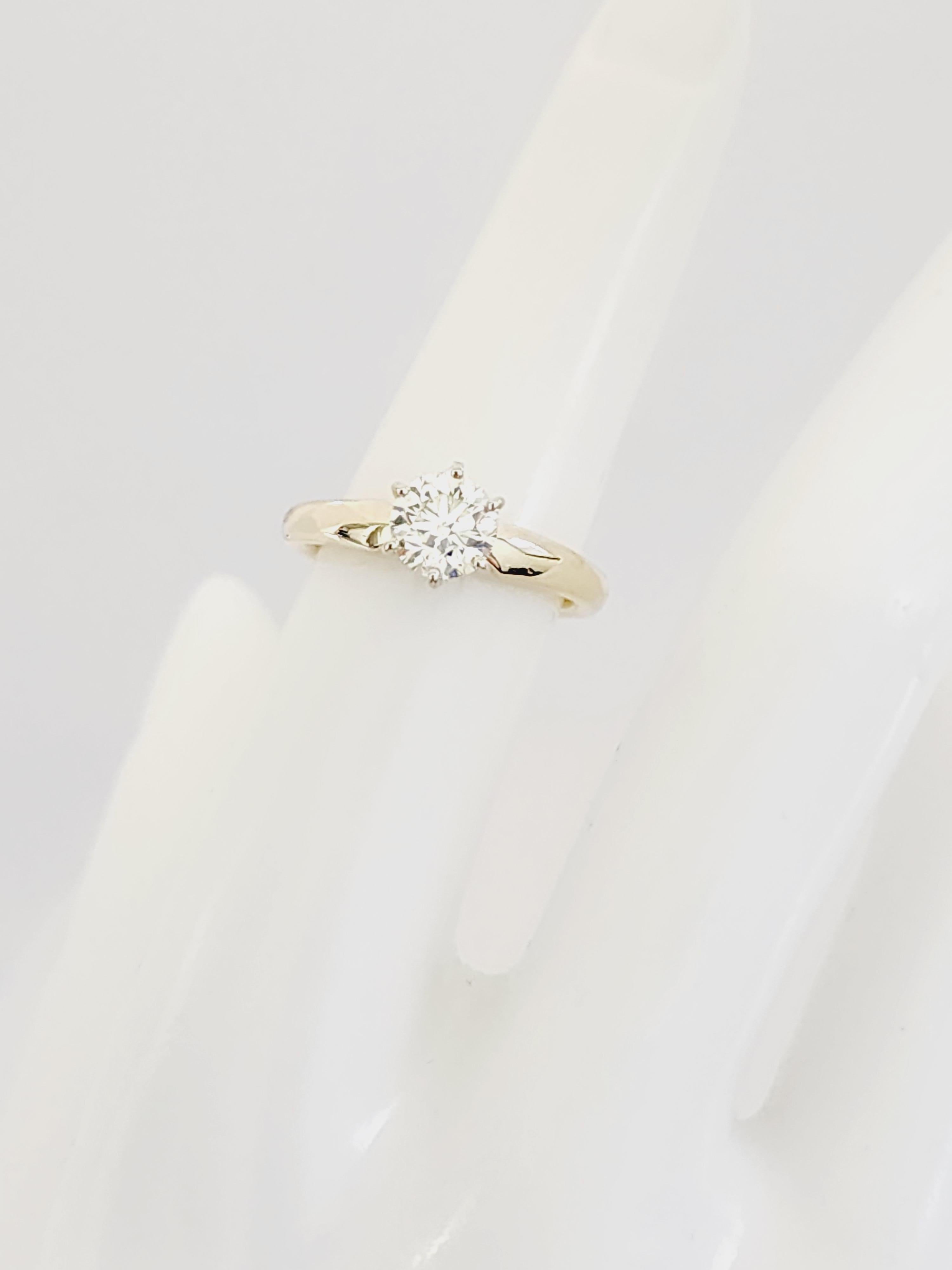 1 Carat Round Natural Diamond Ring Yellow Gold 14 Karat. 
Set on 6-prong 14K solitaire yellow gold. Ring size: 6.5