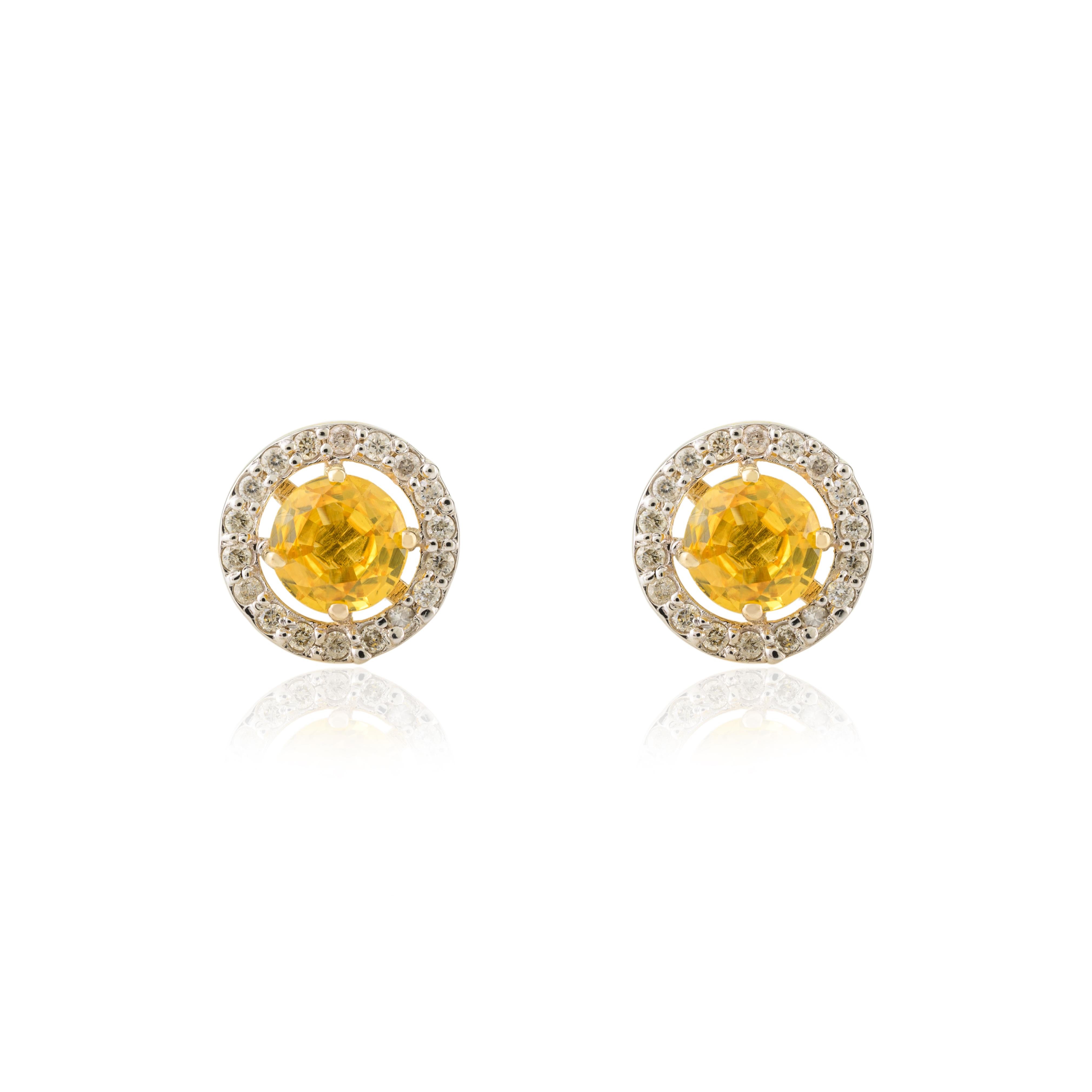 Modern 1 Carat Round Yellow Sapphire Diamond Halo Stud Earrings in 14k Yellow Gold For Sale