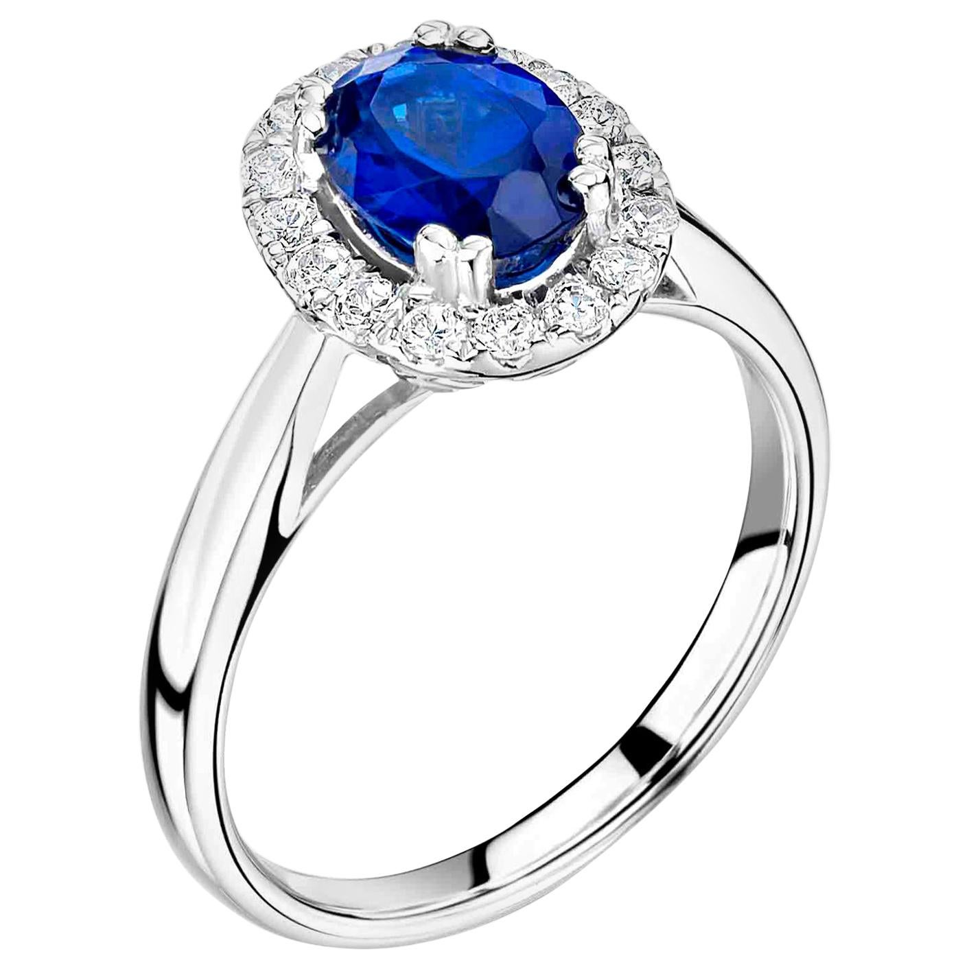 1 Carat Royal Blue Ceylon Sapphire Engagement Ring in a Diamond Halo For Sale