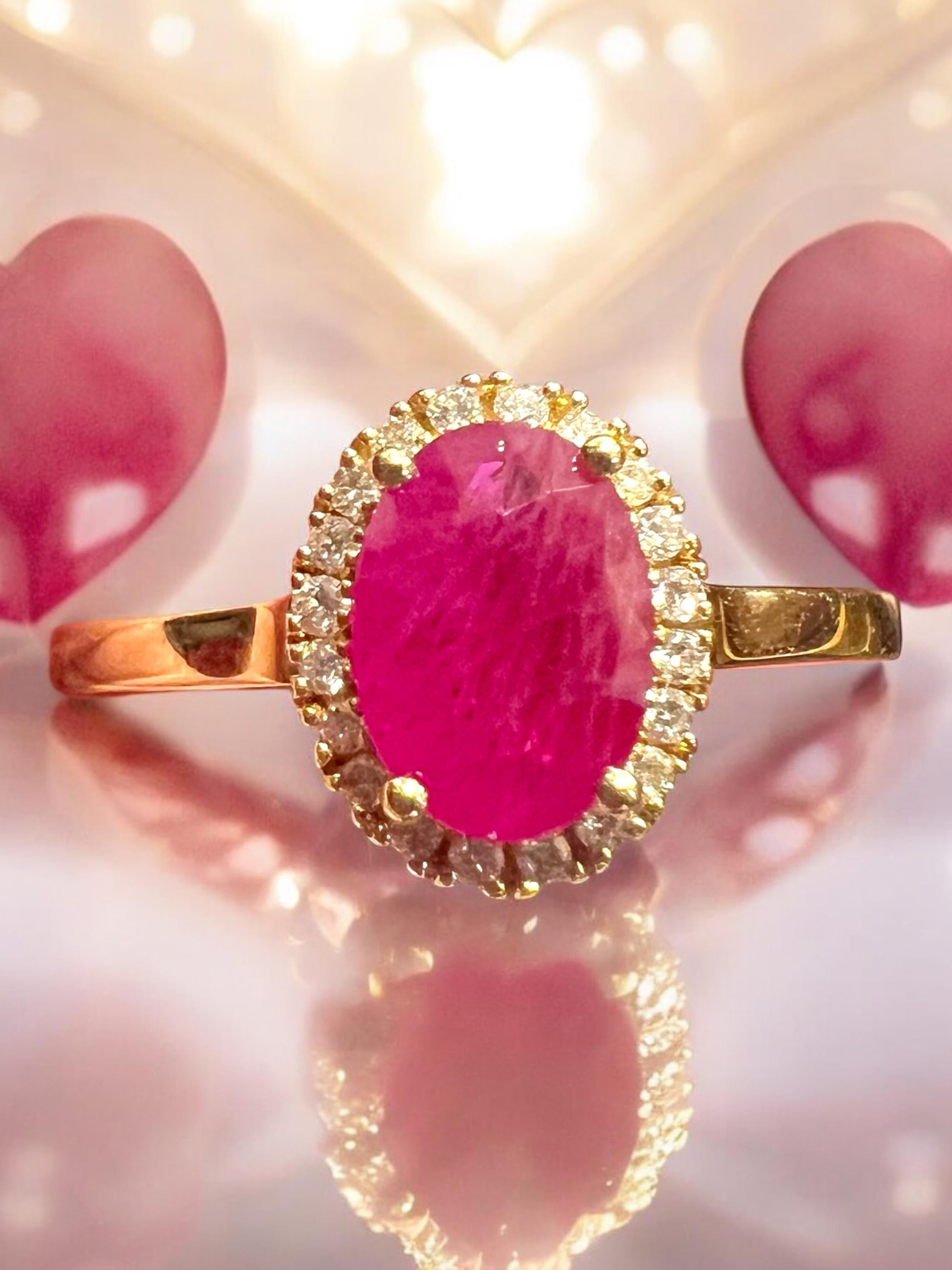 
This charming and refined engagement ring in 18K yellow gold draws inspiration from the timeless elegance of Pompadour-style rings, where a vibrant center stone is framed by a halo of diamonds.

At its heart, it features an oval faceted ruby of