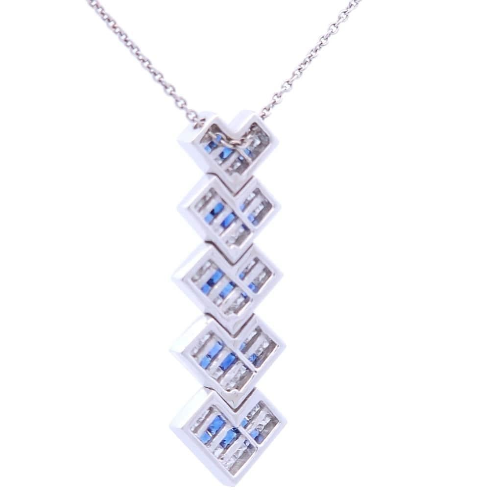 Quality, at the right price.

This designer pendant features a total carat weight of .91 princess sapphires set in 18K white gold. This pendant also features a special invisible setting of princess diamonds with a total carat weight of .91.

The