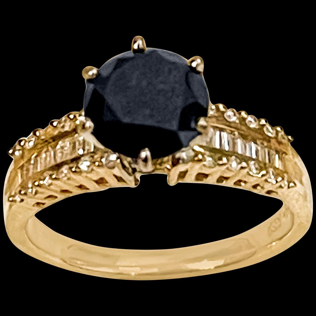 1 Carat Solitaire Black Diamond Traditional Ring/Band 14 Kt Yellow Gold Size 6.5 
 Solitaire round  Black diamond approximately 1  ct and White  diamond, approximately 0.75 ct
White diamonds are baguettes and Brilliant cut round diamonds
This is a