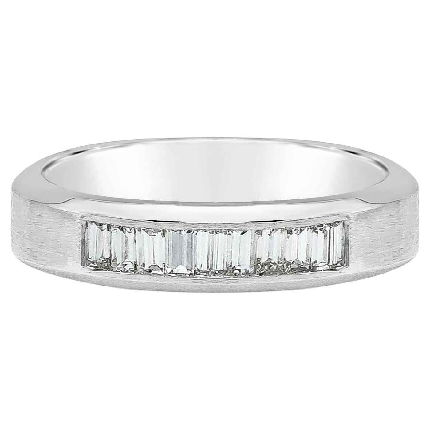 A subtle yet distinctive men's wide wedding band, showcasing baguette cut diamonds weighing 1.00 carat total with G color and VS clarity. Invisible setting with matte finish in 18K white gold. 

Roman Malakov is a custom house, specializing in