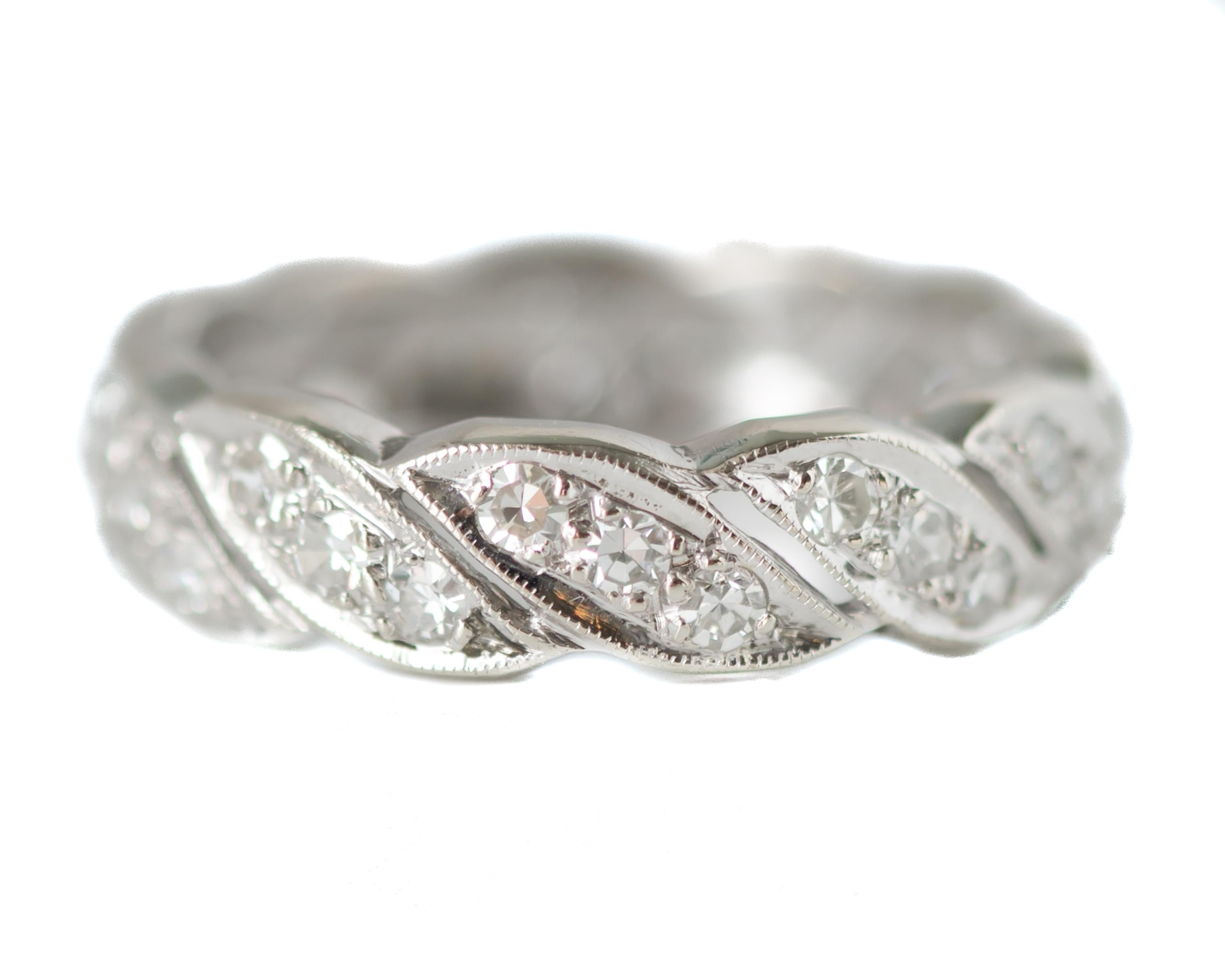 Diamond Wedding Band Anniversary Ring - 14 karat White Gold 

Features:
1.0 carat total Single cut Diamonds crafted in 14 karat White Gold setting
Diagonal Floral Leaf Design - Each Petal or Leaf holds 3 prong set Diamonds
Each segment is outlined